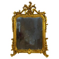 Piccola specchiera in legno intagliato, scolpito e dorato, XIX secolo