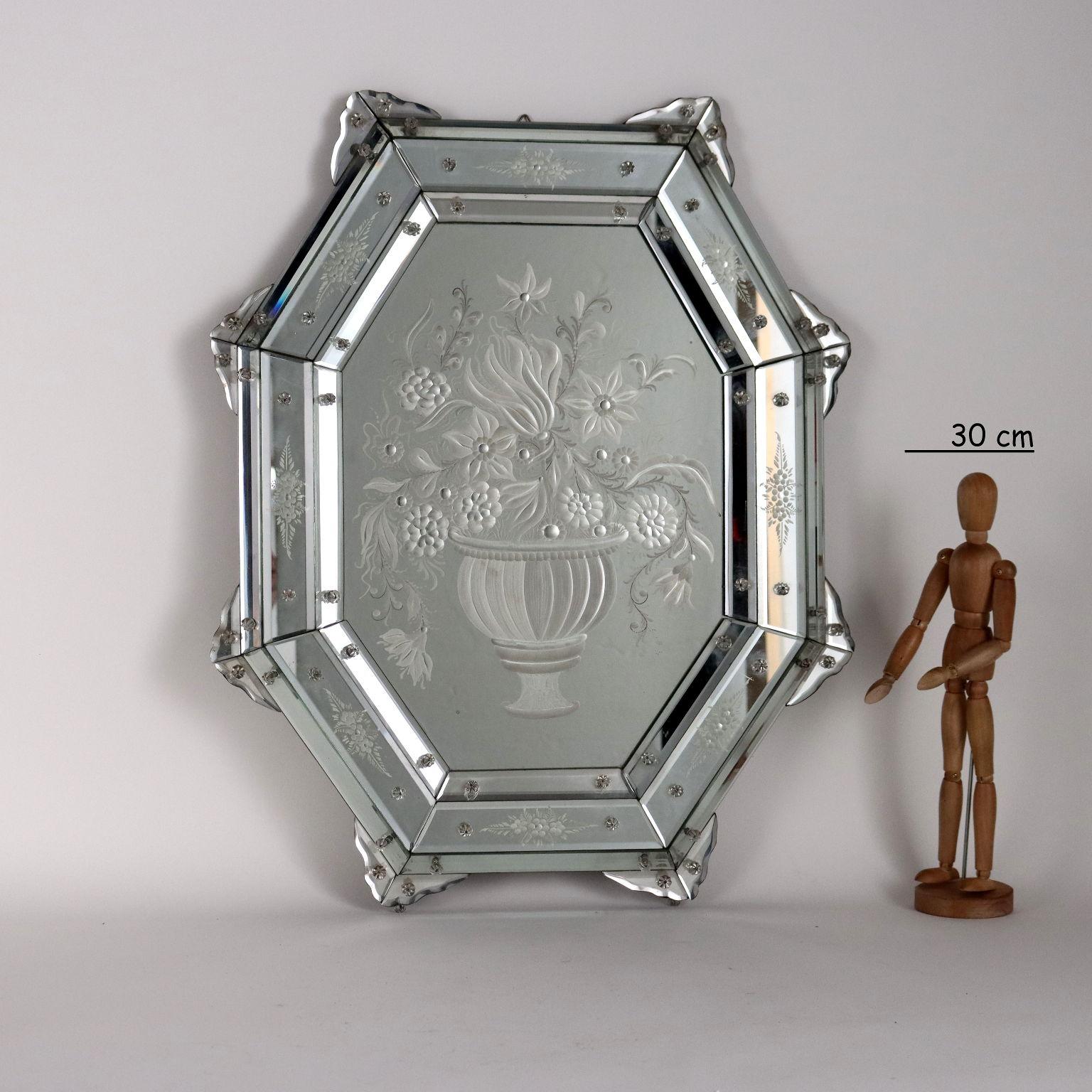Central etched mirror to form depiction of vase with flowers echoing etched and beveled glass frames depicting floral motifs.
Italy early 20th century
