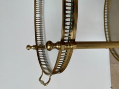 Small oval brass vintage bar cart from the 1970s