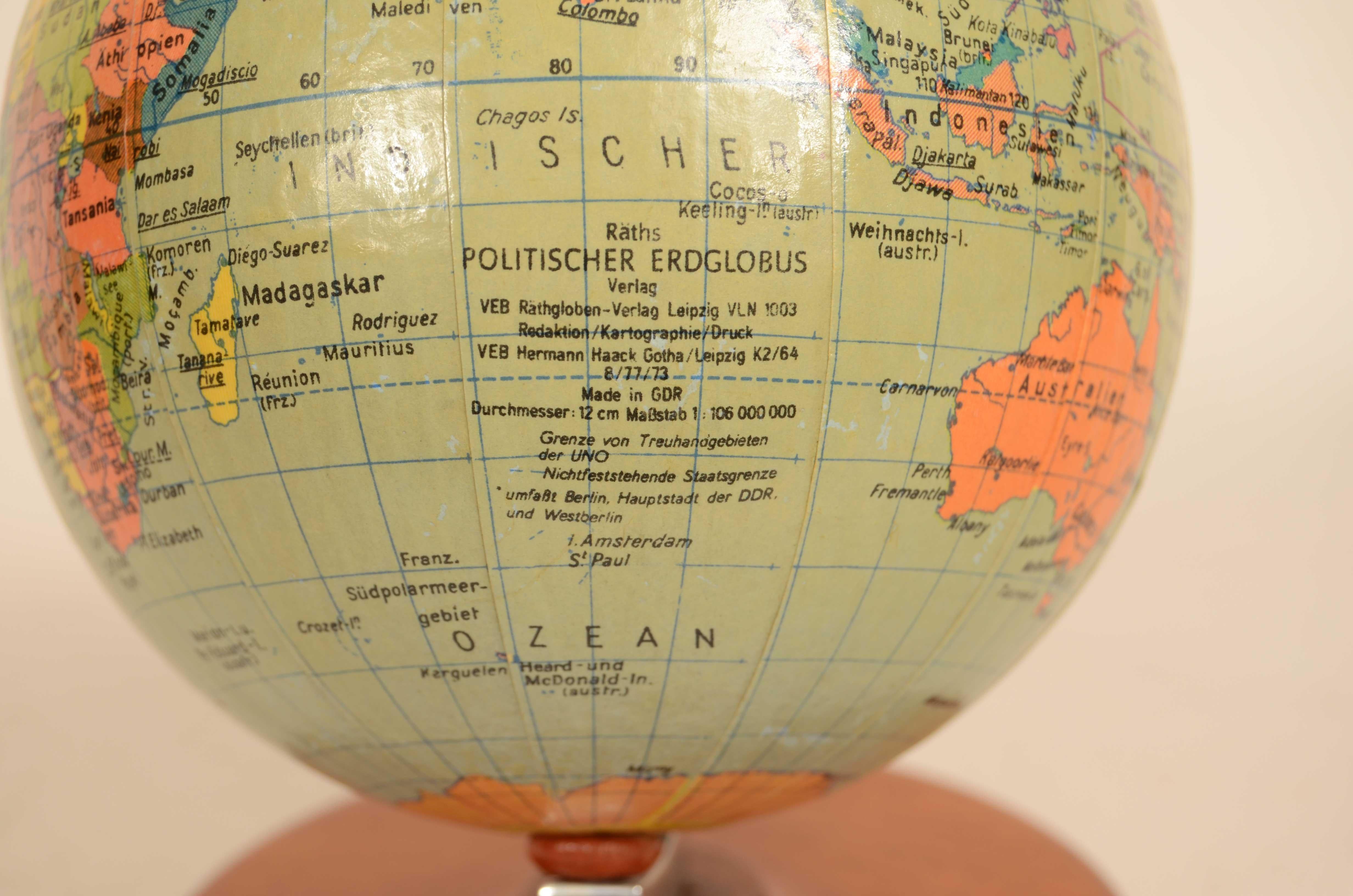 Small globe published by Räths Politischer Erdglobus drawn and outlined by Porf Arthur Krause in the 1950s. Paper mache ball and turned wood base. Height 16 cm - 6.2 inch, ball diameter 11 cm - 4.3 inch. Good condition, excellent readability.