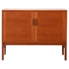 Small vintage sideboard with hinged doors