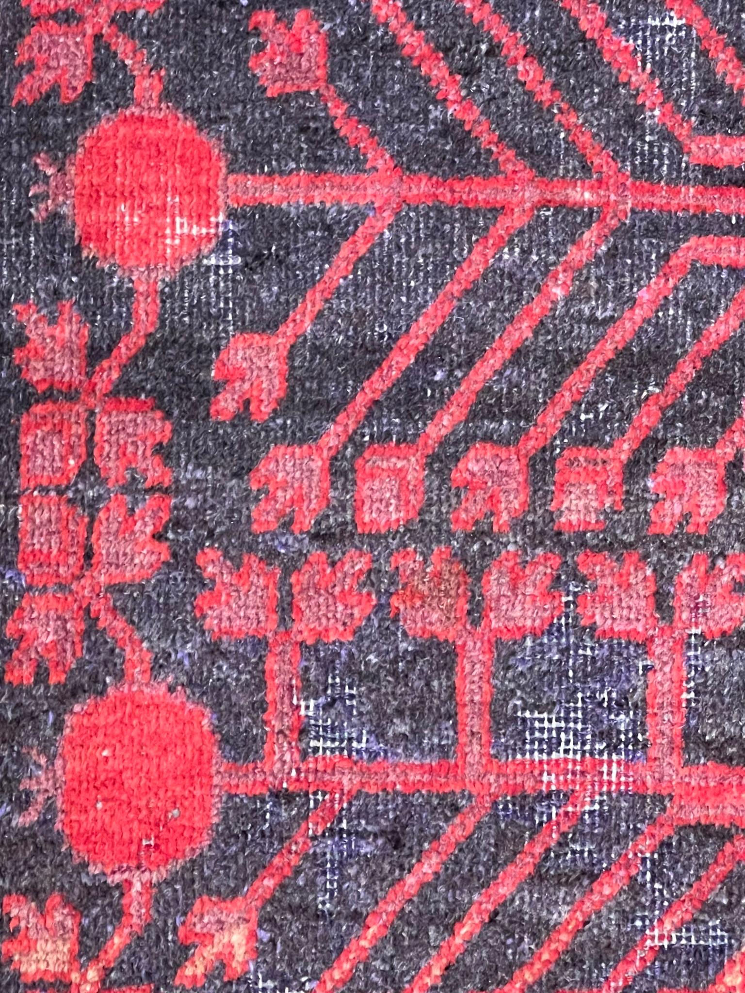 Chinese Small Yarkand rug decorated with pomegranate tones of cochineal red and gray For Sale