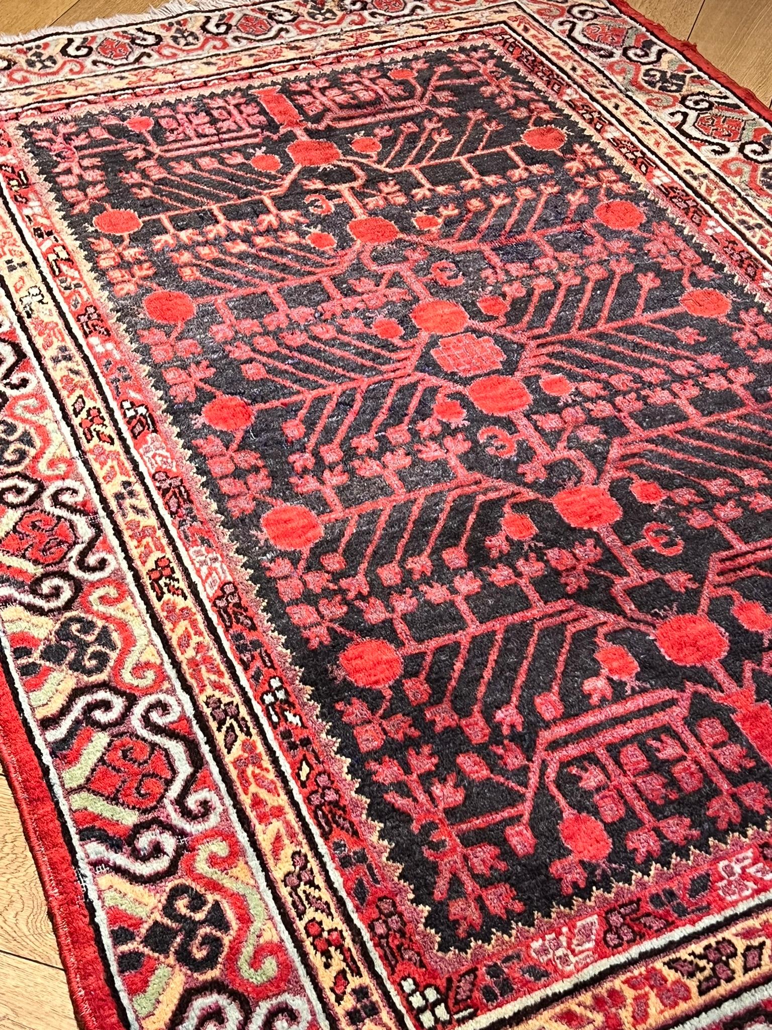 20th Century Small Yarkand rug decorated with pomegranate tones of cochineal red and gray For Sale