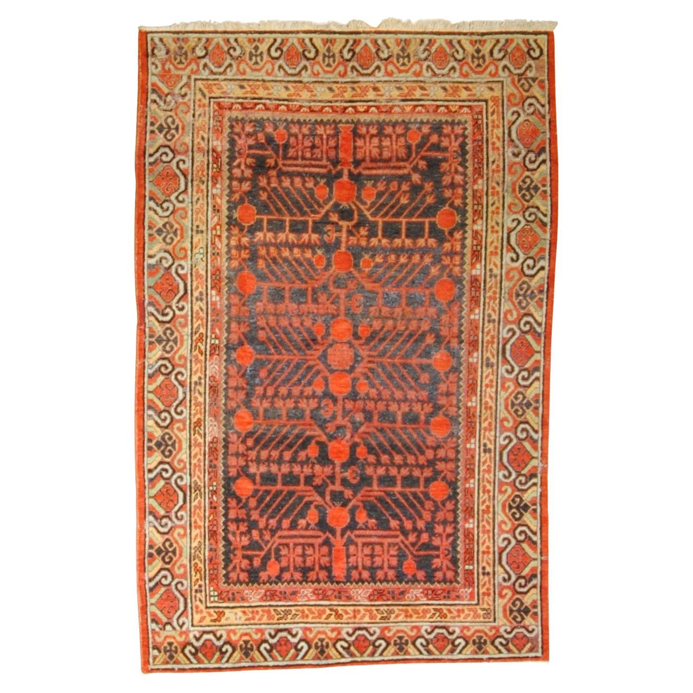 Small Yarkand rug decorated with pomegranate tones of cochineal red and gray For Sale