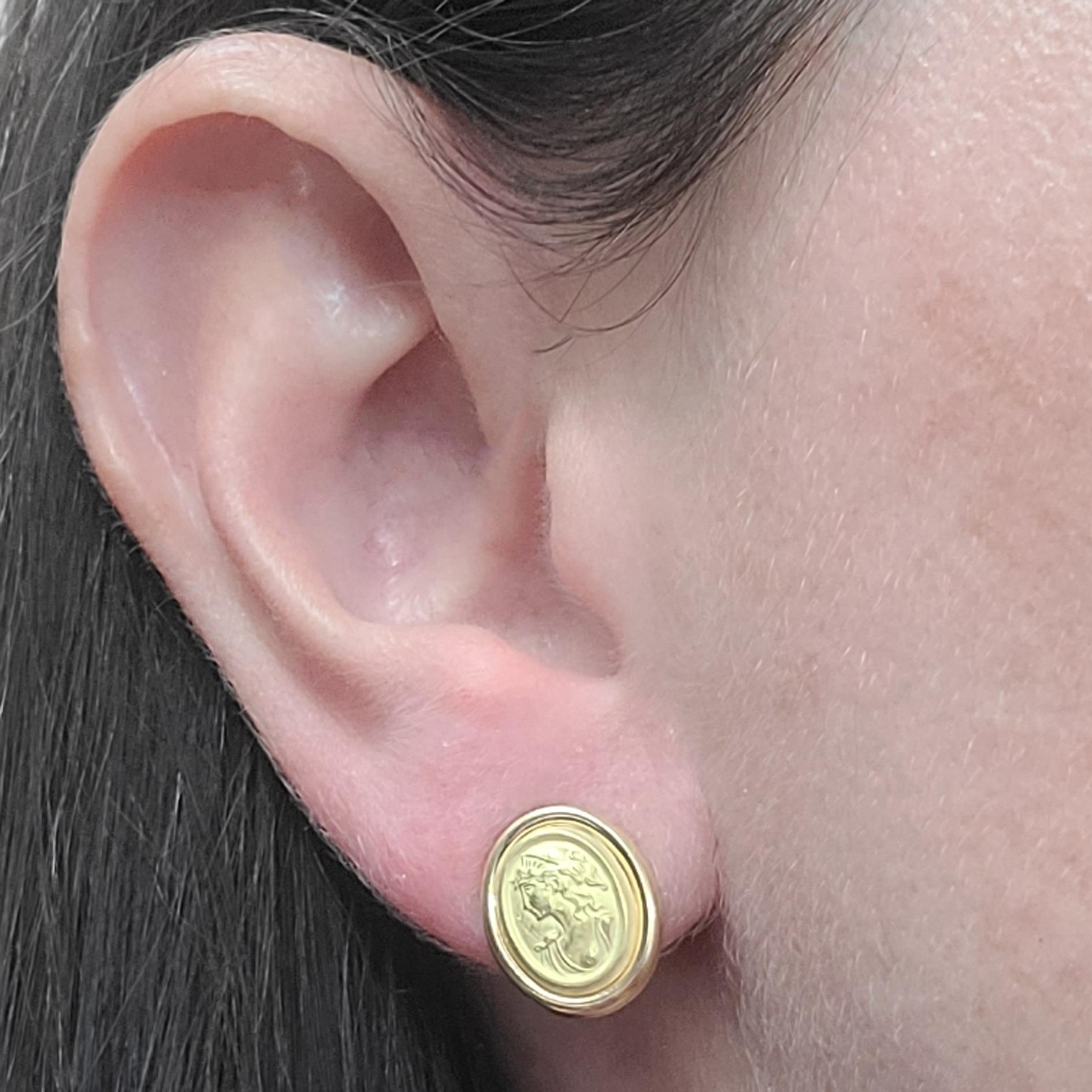Picinotti 18 Karat Yellow Gold Oval Stud Earrings With Brushed Relief Of A Woman's Profile. Pierced Post With Friction Back. Finished Weight Is 2.2 Grams. Made in Italy.