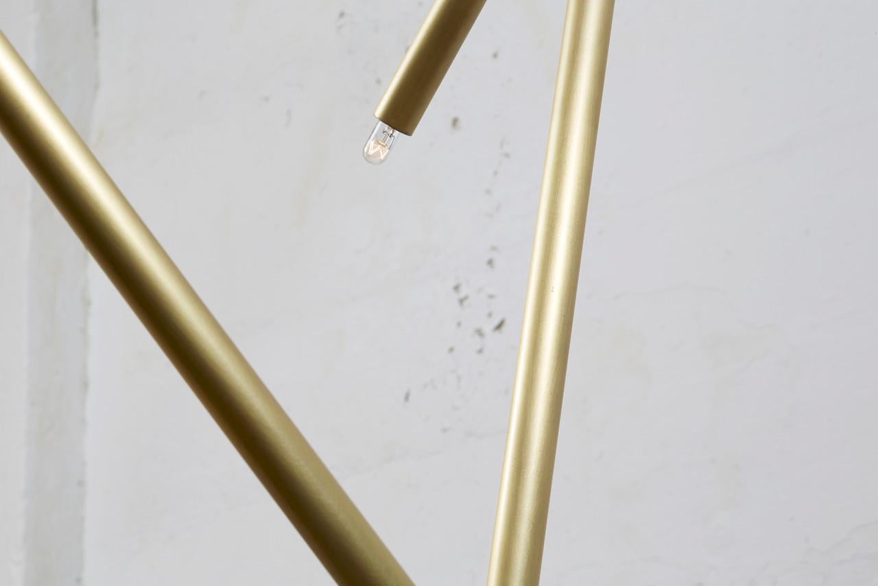 Measurements 68 W x 59 D x 53 H inches
Drop length: 53 inches.
Canopy: 6 W x .25 H inches.
Shown in brushed brass.

Dimensions and finishes may be customized.
Prices may vary depending on finishes and options.

The Pick Up Stick collection