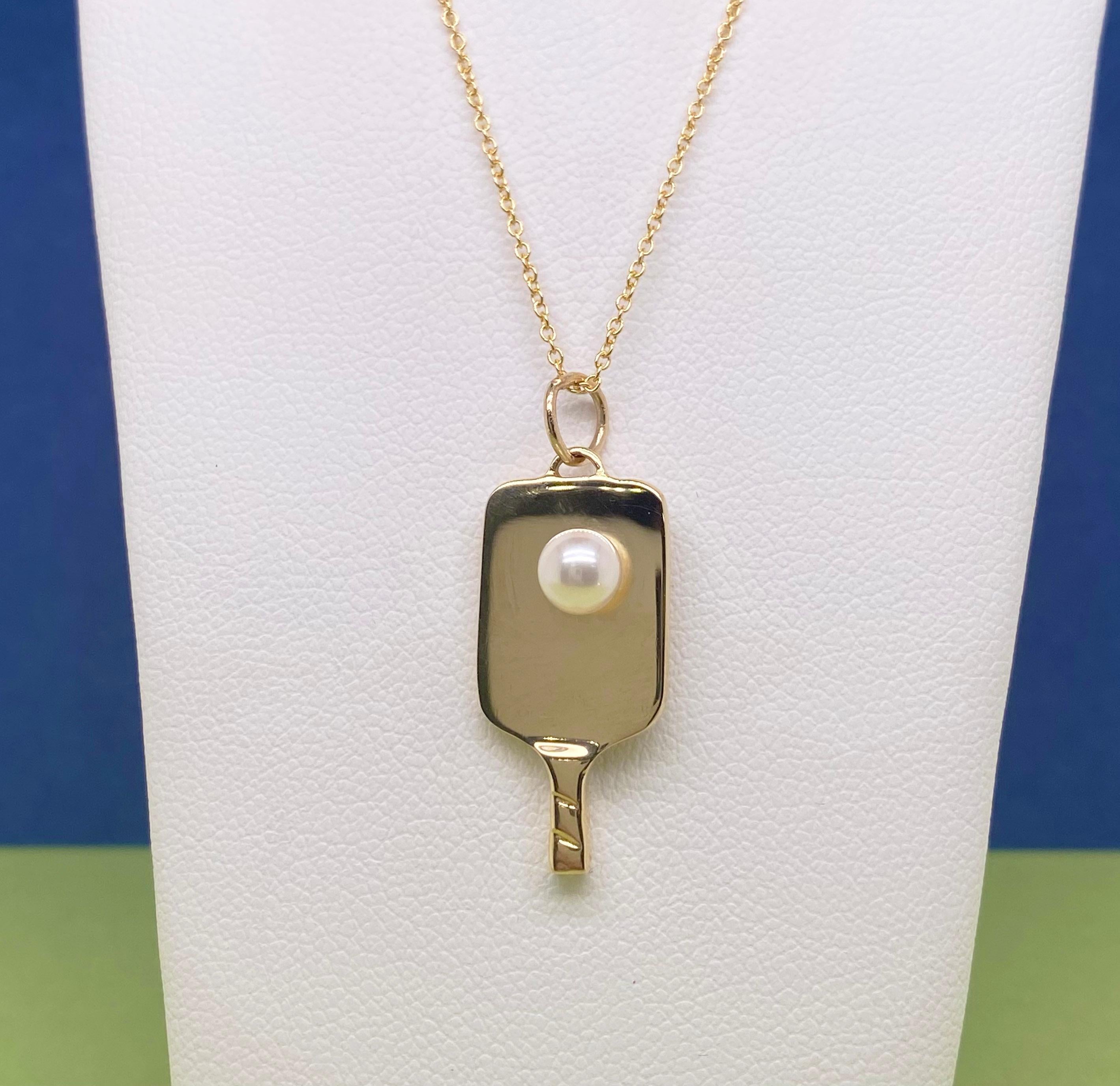 High quality pickleball jewelry is hard to find! This handmade pickleball pendant is the best quality design you will find. It comes with a genuine cultured pearls and is solid 14 karat yellow gold.  If you love Pickleball, you will love showing off