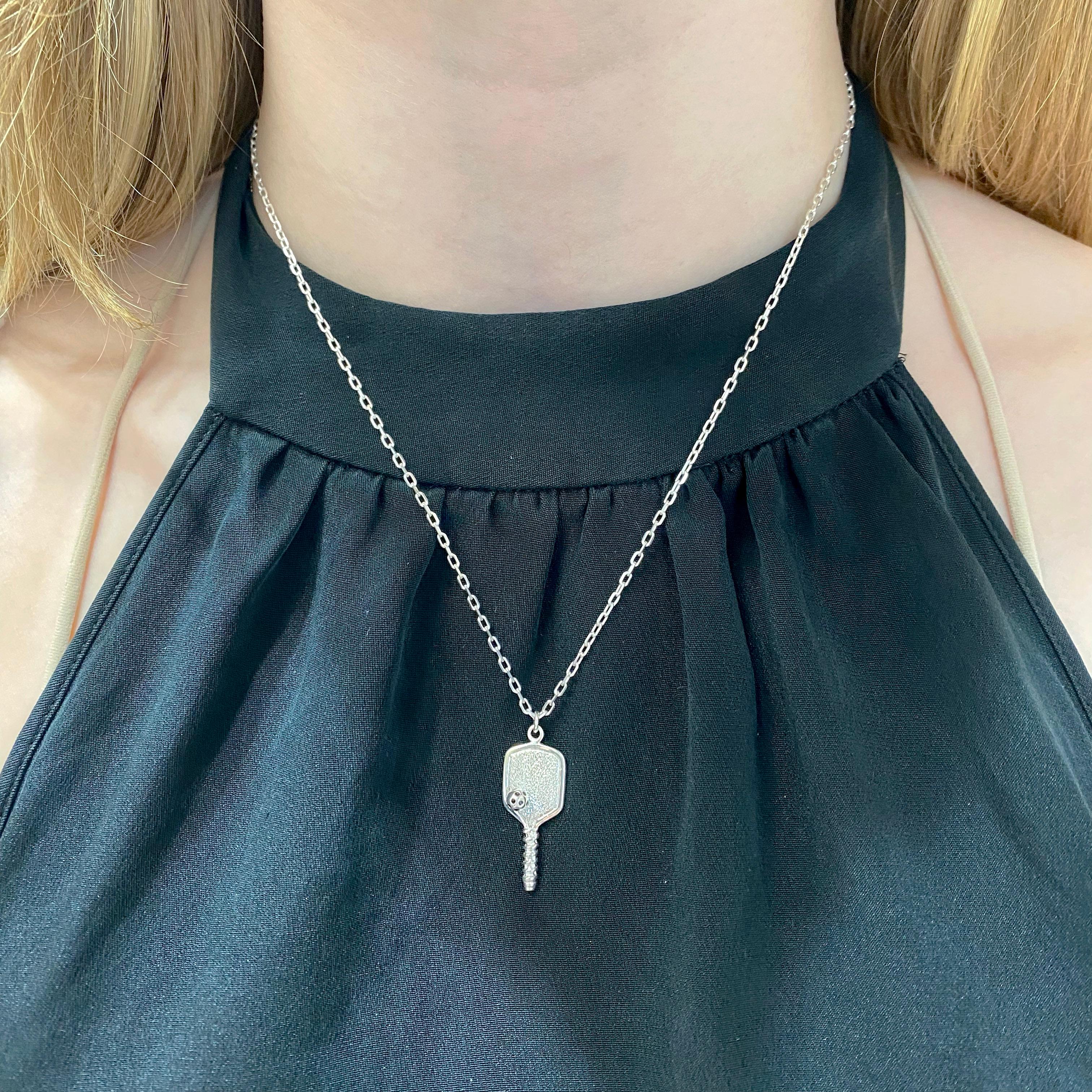 This Pickleball Paddle Necklace was handcrafted by our jewelers at Five Star Jewelry in Austin, Texas! We love pickleball and play almost everyday so we wanted to design a necklace that showed how much we love the sport! The necklace is the famous