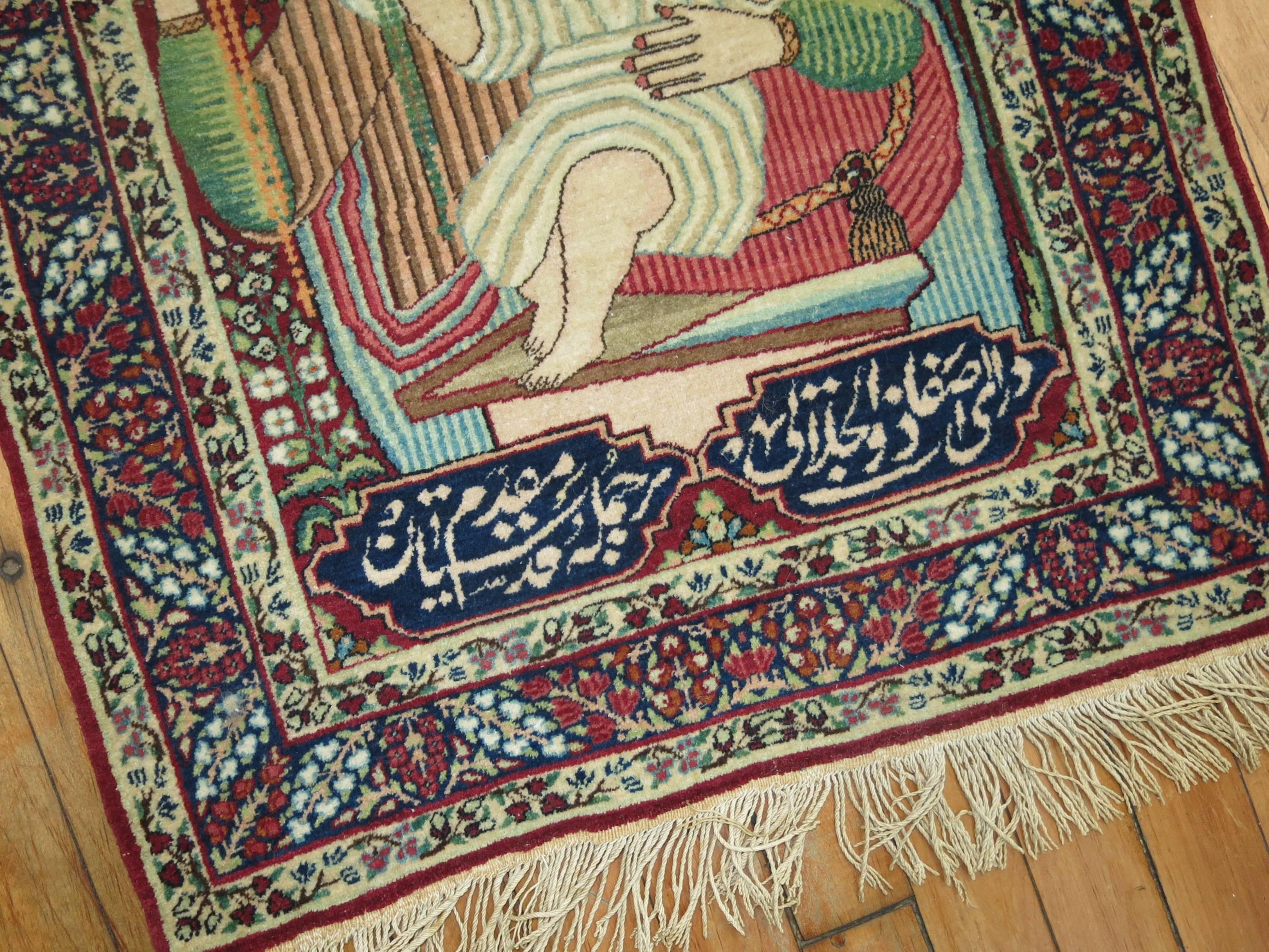 An early 20th century fine quality Lavar Kerman pictorial rug with Mother Mary holding Jesus Christ as an infant. The inscription is a love poem written in Arabic.