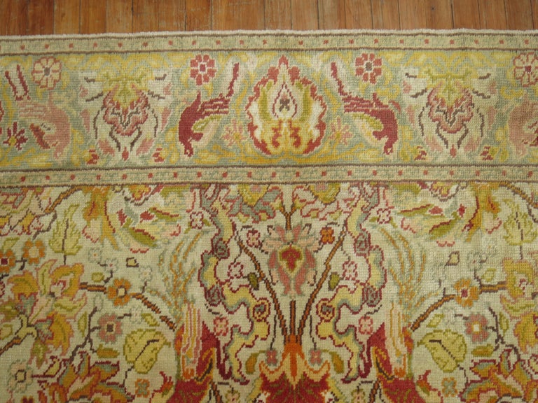 Room size pictorial Turkish Sivas carpet from the second quarter of the 20th century. The ivory field with a flurry of exotic animals spotted in field and border, accents in lime green, yellow rust, and coral. A conversation piece that would be