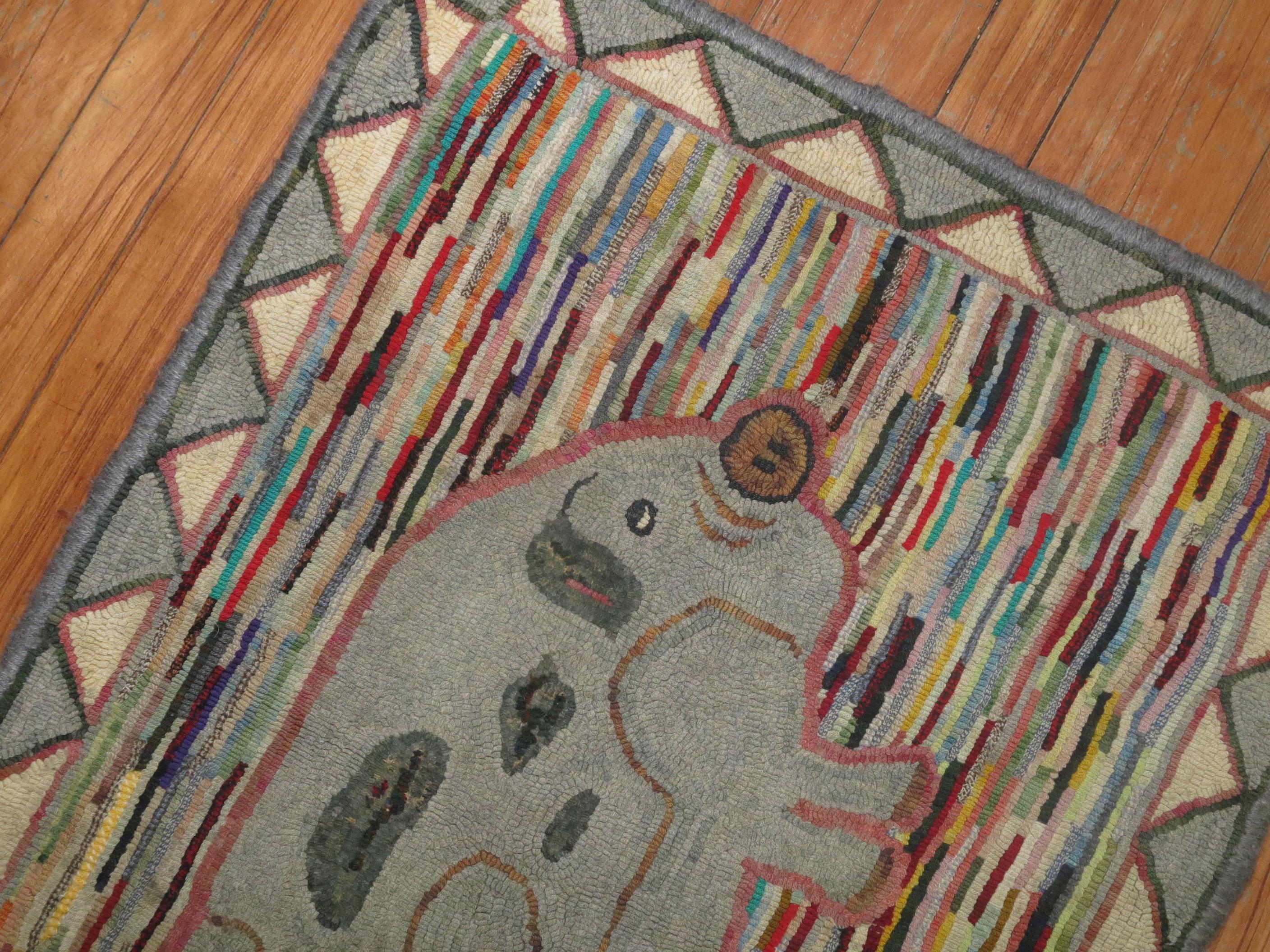 A handmade one of a kind decorative American hooked rug from the early part of the 20th century depicting a pig. Condition is really nice. No stains, no tears, has been professionally cleaned. Blue fabric backing added for extra protection.