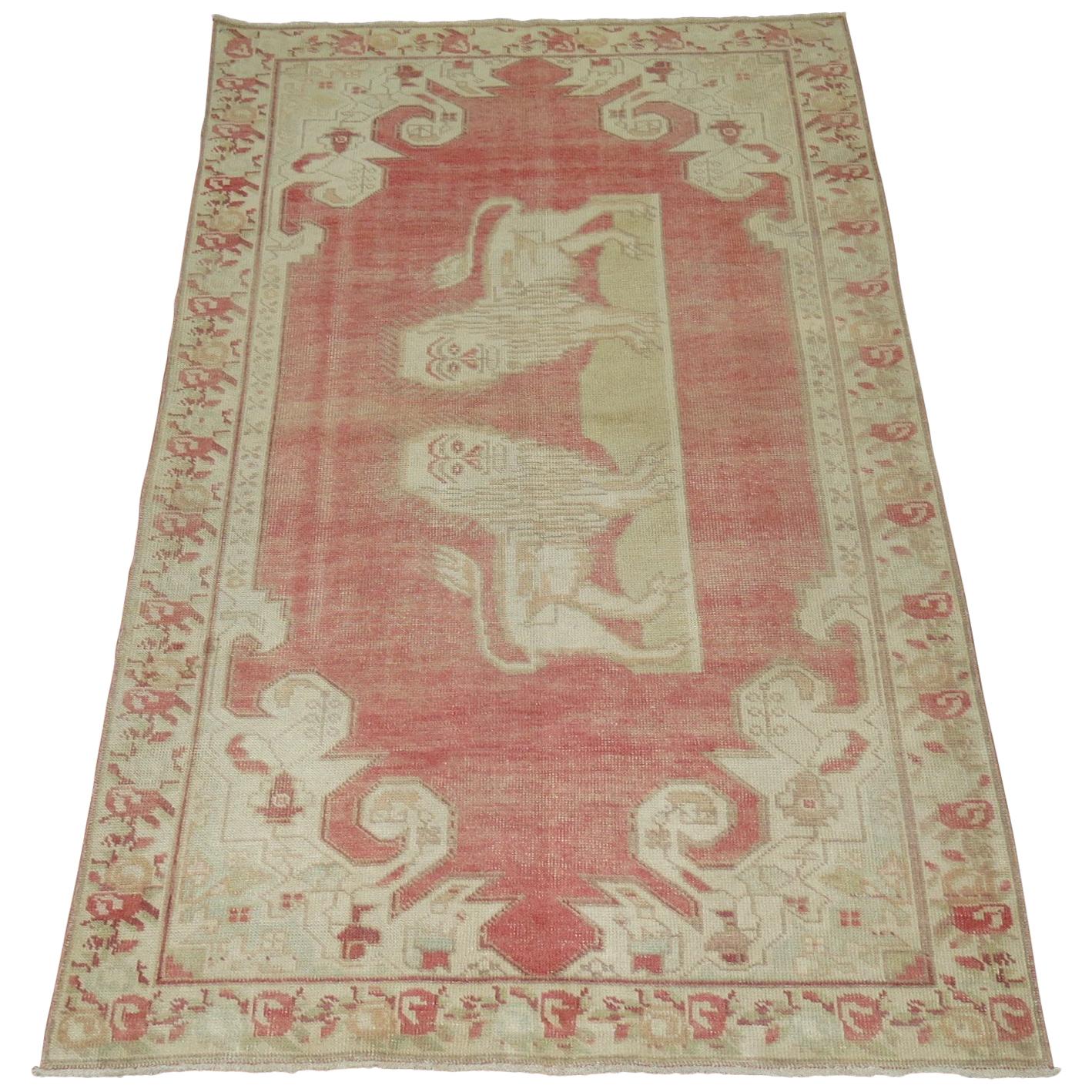 Pictorial Animal Vintage Turkish Anatolian rug in soft pink and cream accents.