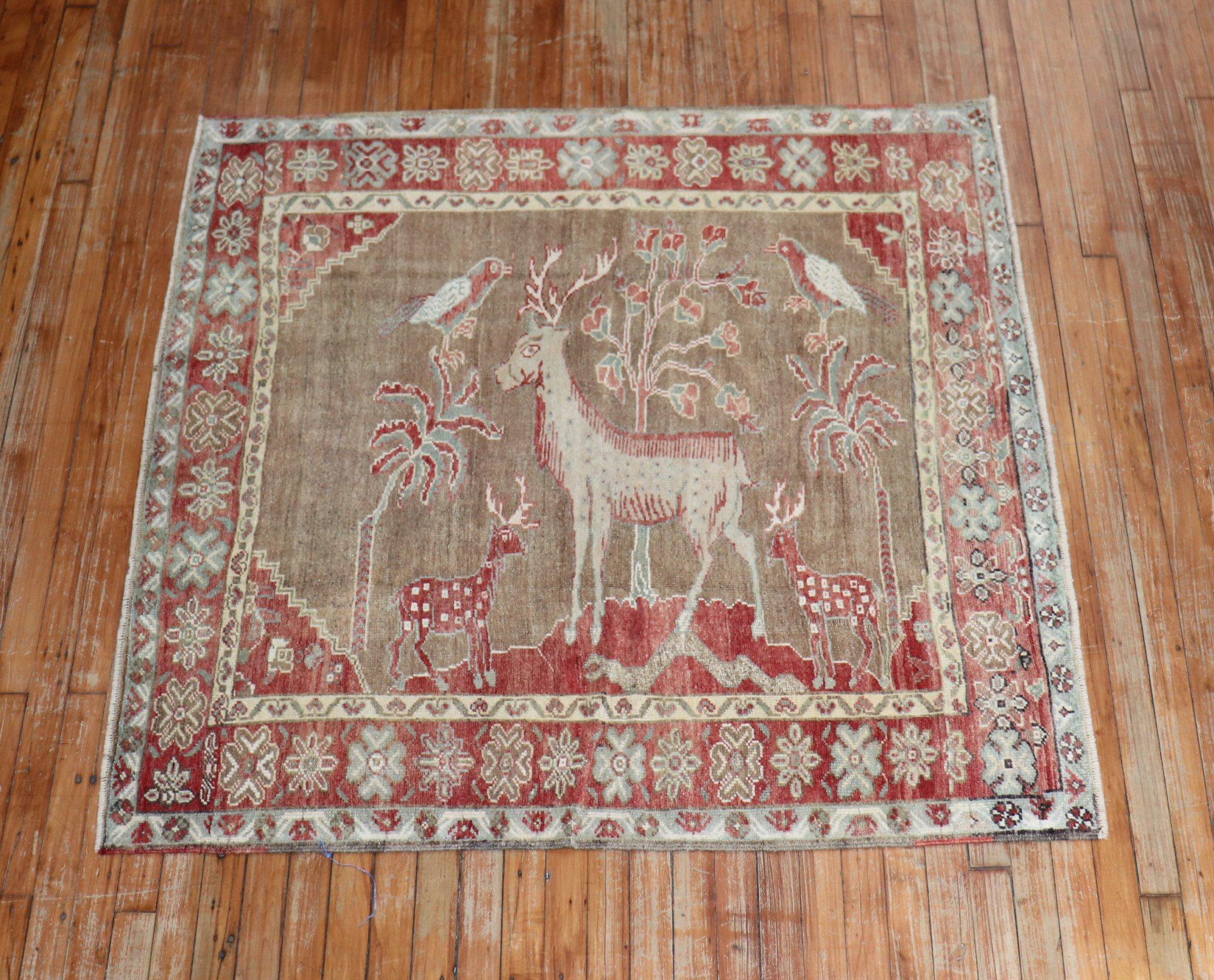 One of a kind hand-knotted Turkish Anatolian Rug in pale peach, brown, and green accents depicting 3 deers and 2 birds, circa 1940. Square Shape too

Measures: 4'6” x 4'8”.

 