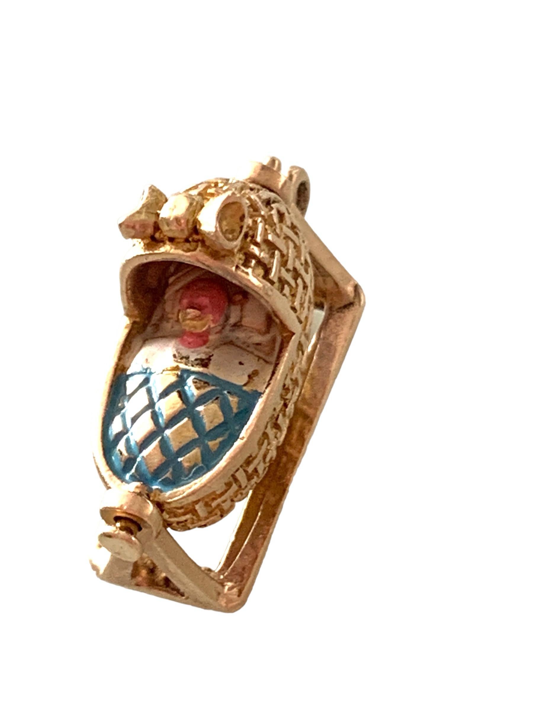 9ct gold Vintage Rocking babies cradle charm
the actual baby's bonnet, and blanket  are enameled which has slightly worn
Fully Hallmarked 
Payton & Pepper & Sons Ltd dated 
Stamped 9375 on one side of the cradle 
and the cradles stand is fully