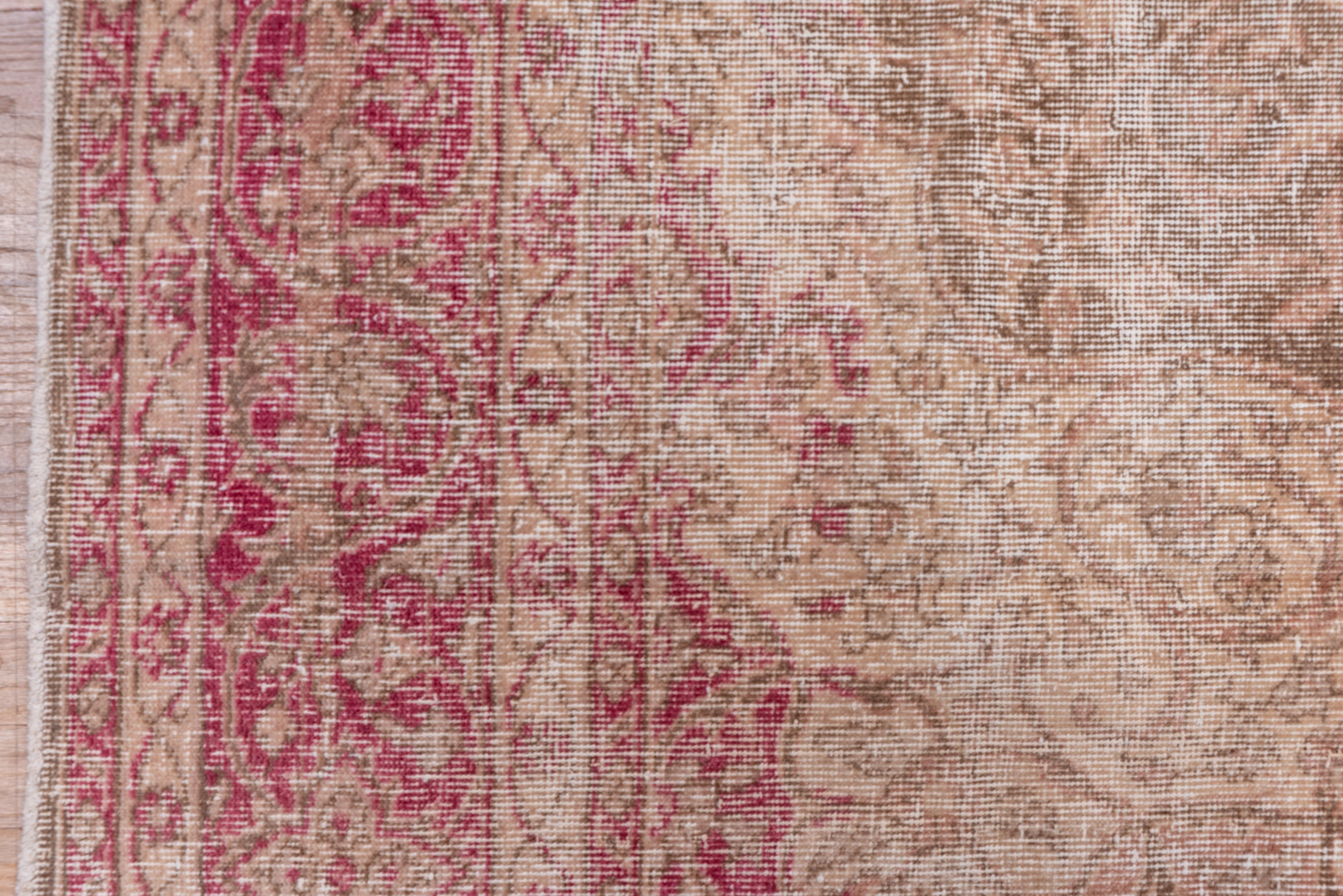 Like many of our rugs, this Oushak tells a story. Decades have come and gone but this rug remains, nearly 100 years since being knotted together. A former bright clean red has been fantastically overdyed with a rustic orange/red dye, this medallion