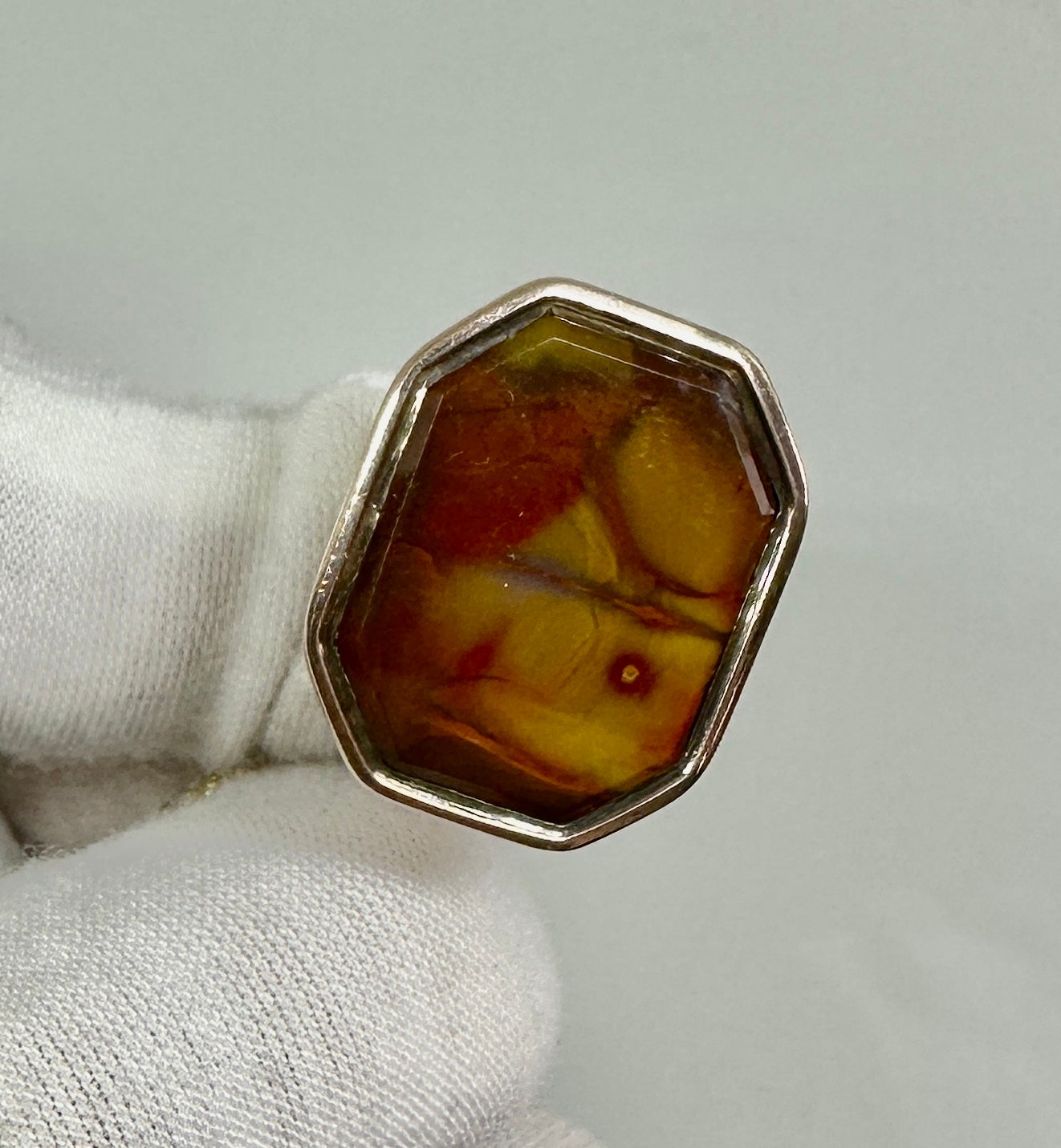 THIS IS A WONDERFUL PICTURE AGATE FOB. THE LARGE FOB IS 10 KARAT ROSE GOLD AND DATES TO THE VICTORIAN PERIOD. 
How wonderful to find this charming fob with a gorgeous large picture agate gem. 
The gem is faceted along the borders. It has a wonderful