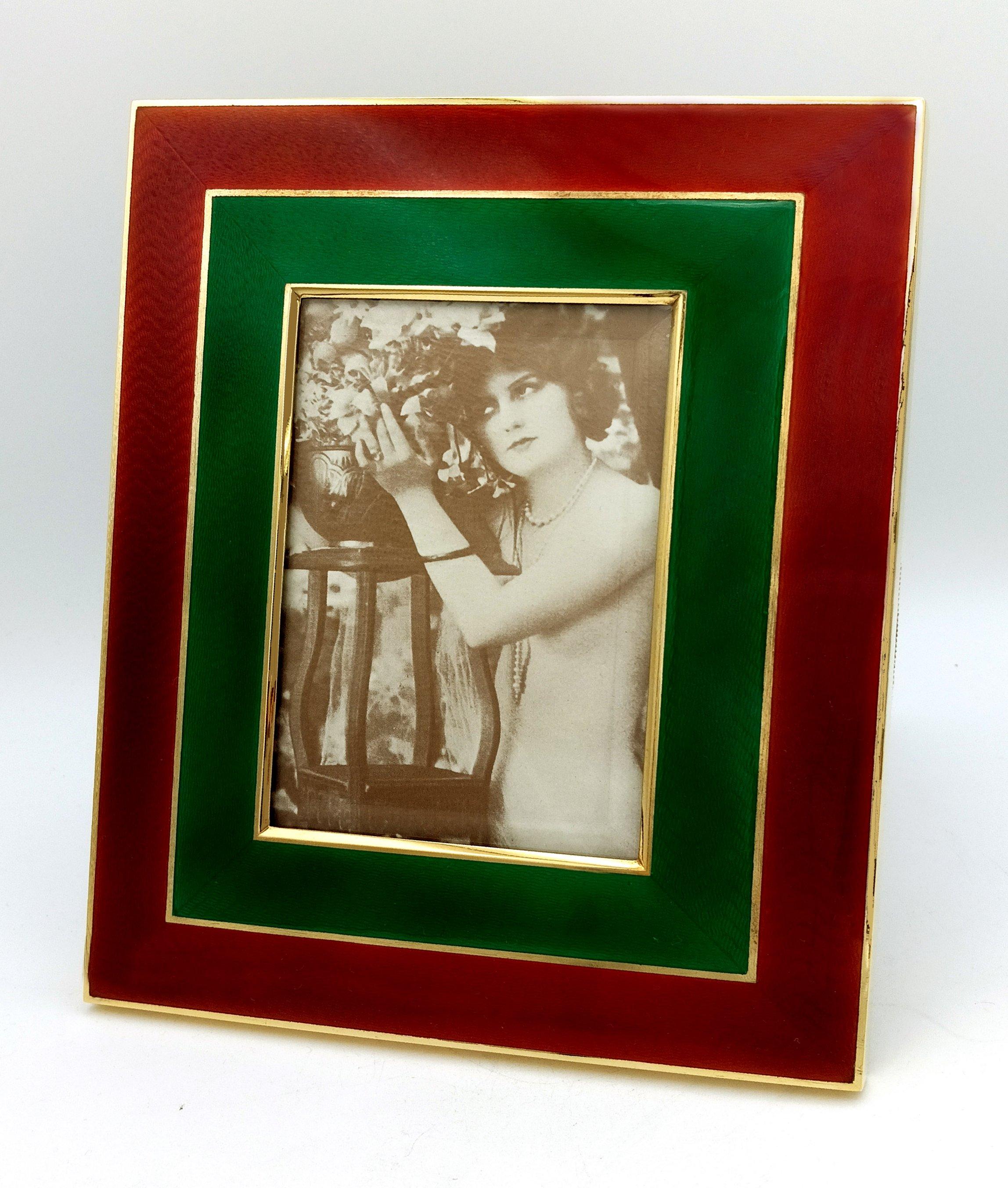 Large rectangular photo frame in gold-plated 925/1000 sterling silver with translucent enamels fired on guilloche in two colors, in a modern contemporary style. External cm. 18 x 22, internal cm. 9 x 13. Weight g. 548. Ground glass, panel in blue
