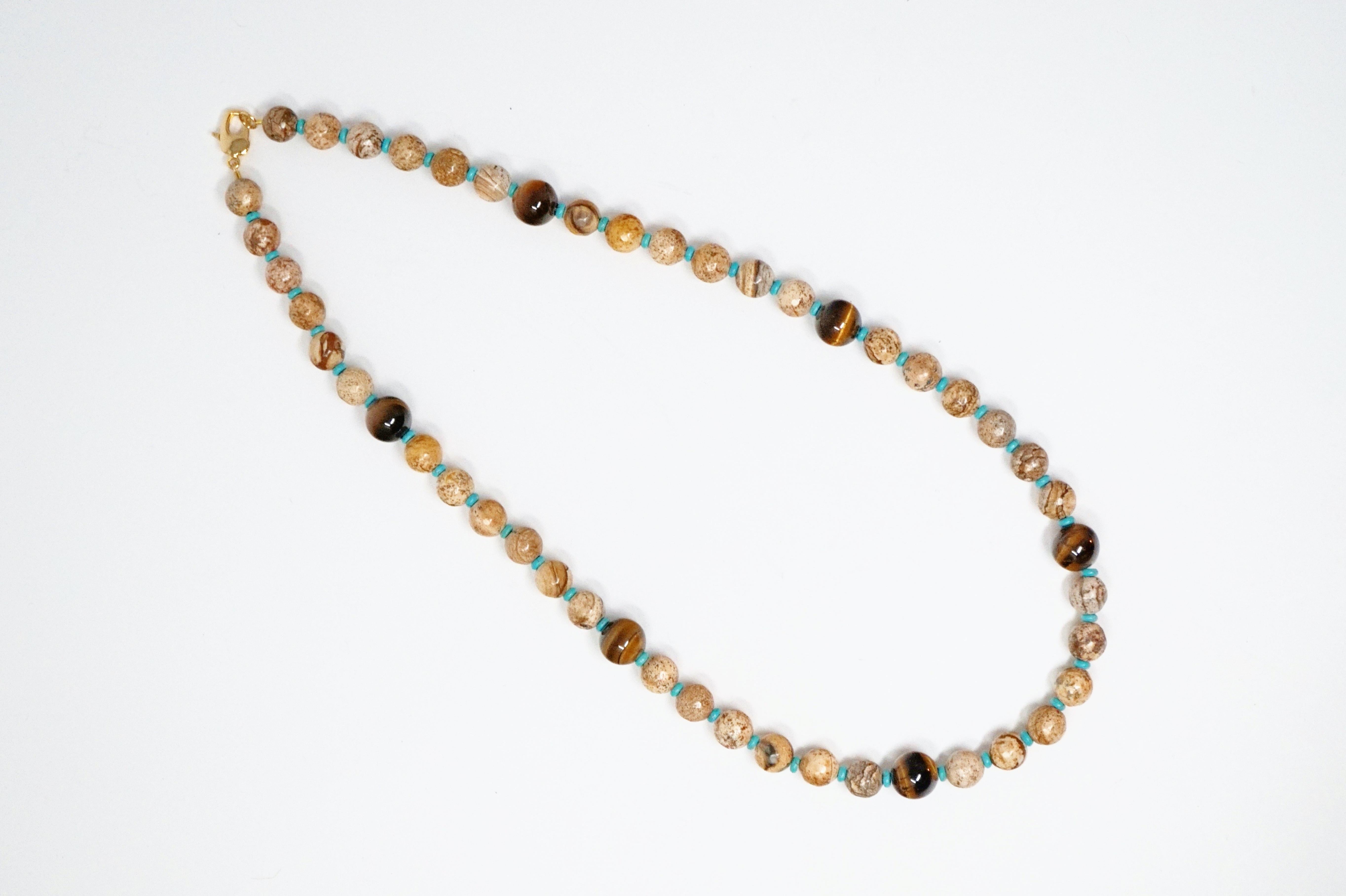 Gorgeous natural Picture Jasper gemstone necklace accented with Tiger's Eye and Turquoise.

DETAILS:
- Natural Picture Jasper, Tiger's Eye and Turquoise gemstones
- 10mm Picture Jasper beads and 12mm Grade A Tiger's Eye beads
- Gold-plated lobster