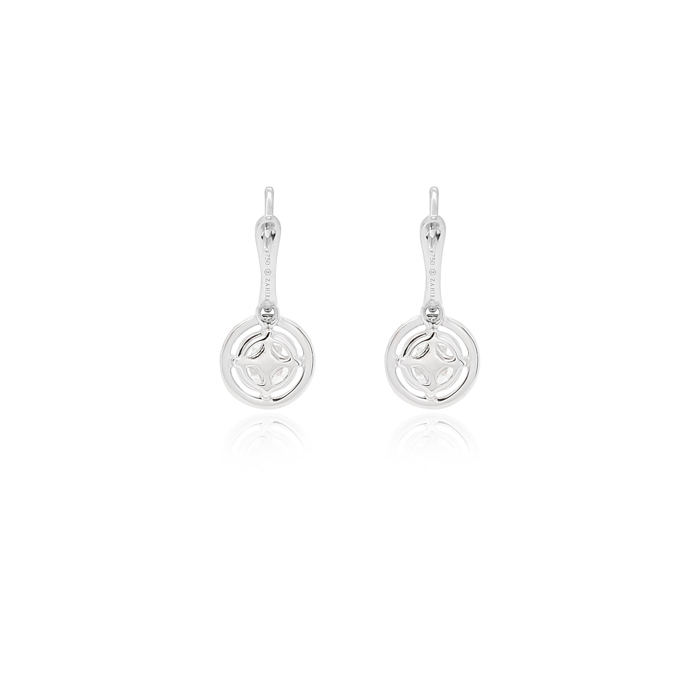 These exquisite Diamond Pie Cut Earrings are a true testament to elegance and brilliance. With a clever design that creates the illusion of over 1 carat center stone, these earrings feature a dazzling diamond halo that amplifies their size and
