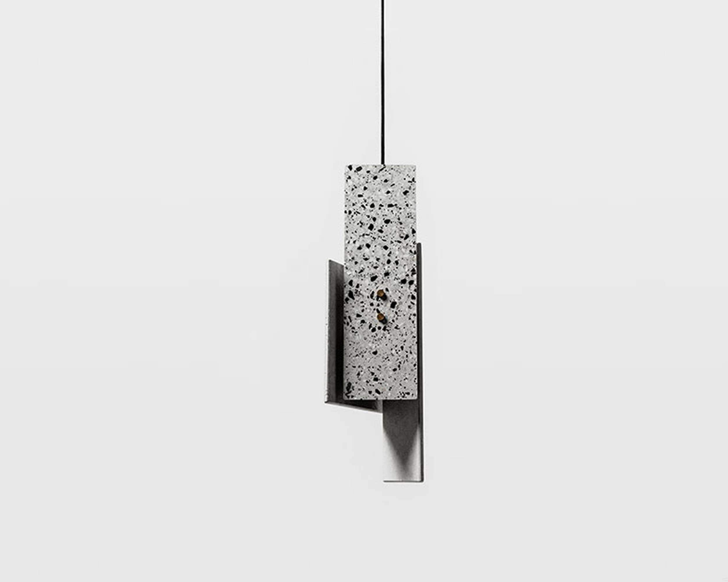 Terrazzo pendant lamp designed by Cantonese studio Bentu Design

Black wire 2m adjustable. Bulb E27 LED 3W 100-240V 80Ra 200LM 2700K 
53.2 cm x 17.7 cm x 16.3 cm

These pendant lamps are available in different colors of terrazzo: white, black, red