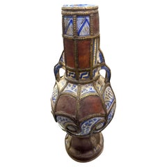Pieced Painted And Leather Pieces and Brass Trim Vase, Morocco, 19th Century