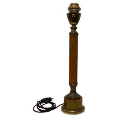 Pied de lampe en bakelite ambré et laiton doré style Jansen