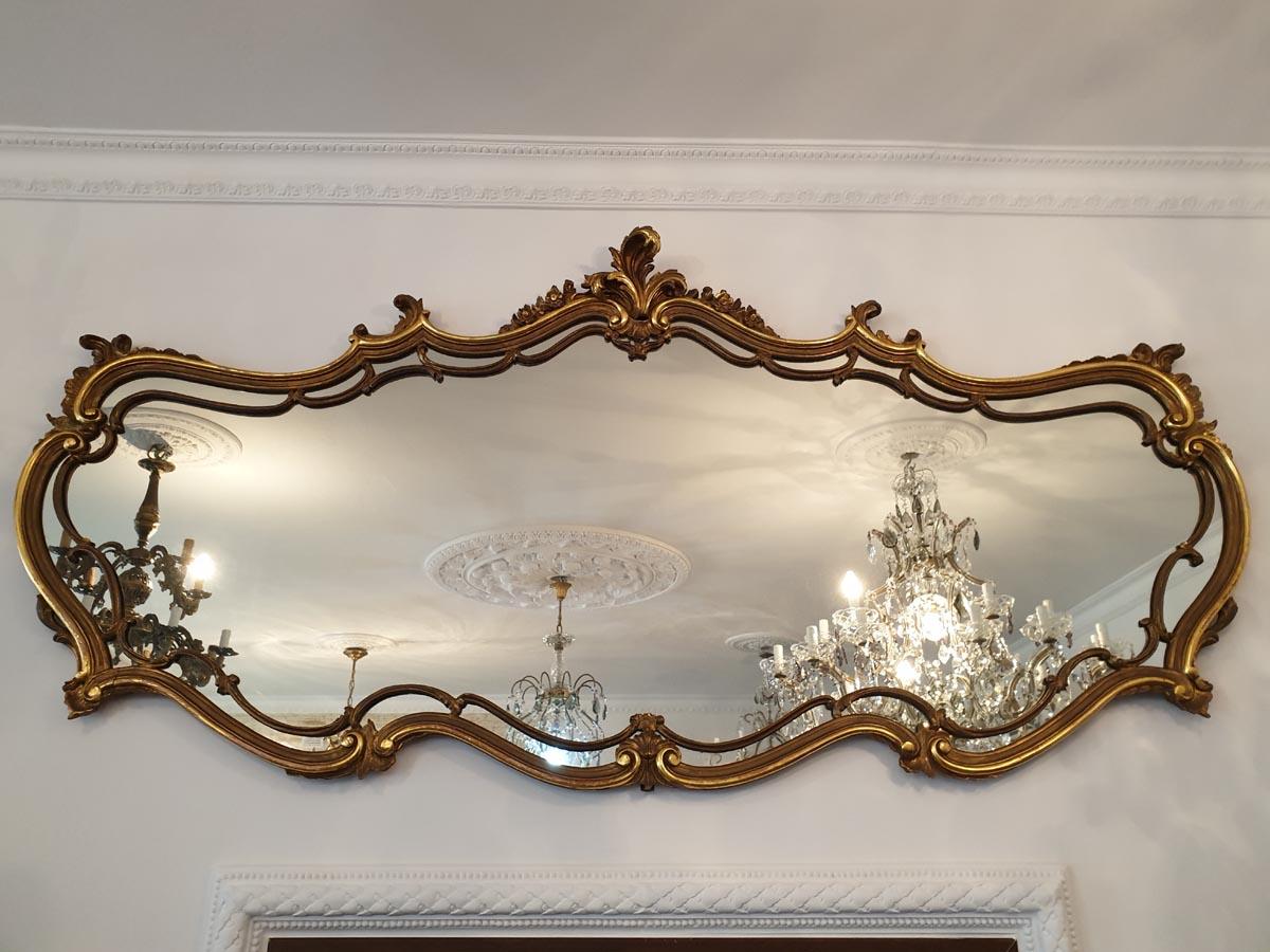 Representative and beautiful in form, over 2-meter wide panoramic mirror in the style of the so-called Piedmont baroque.

Mirrors of this type are found in antique trading very rarely.

Wood, hand-gilded with gold leaf.

An extremely