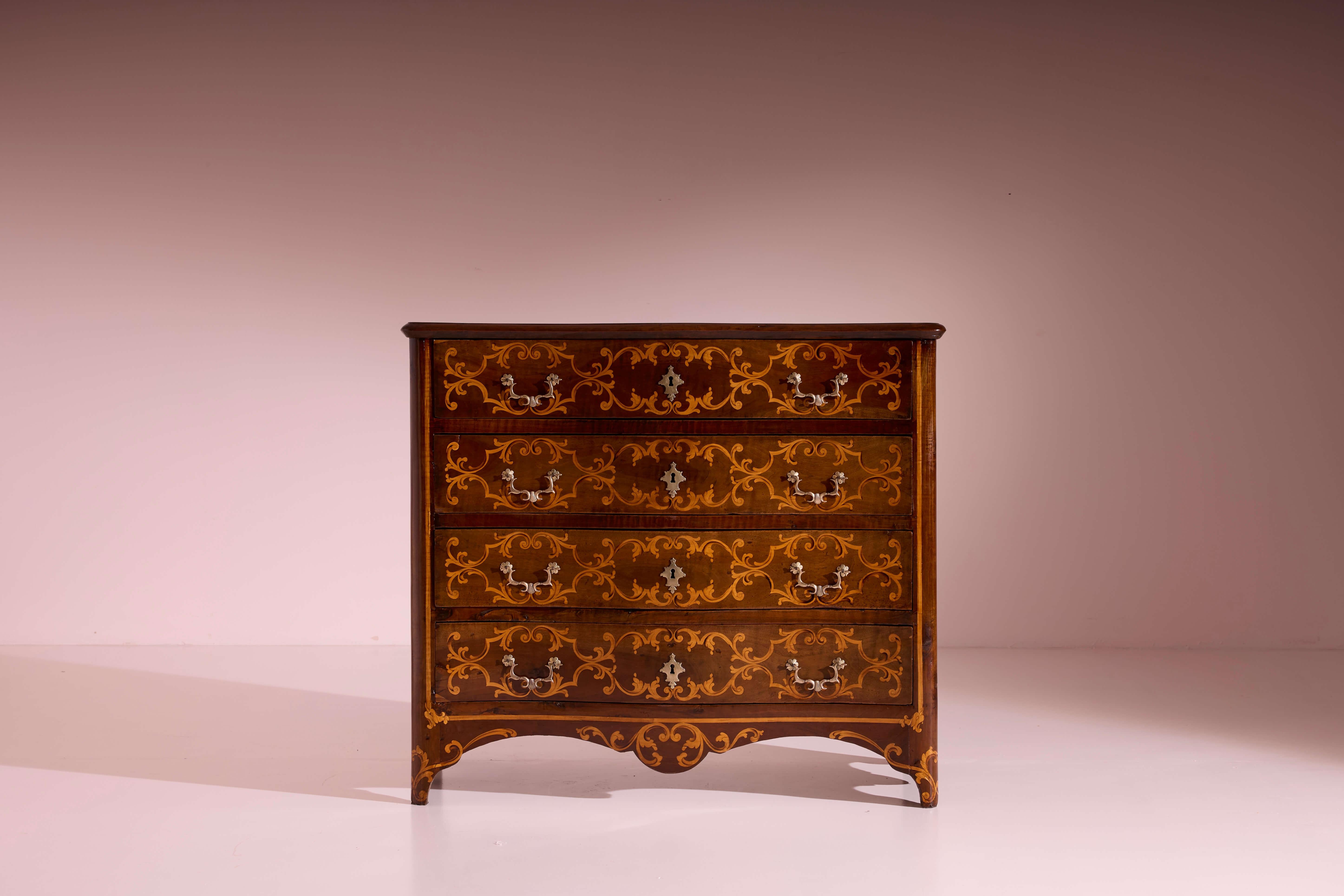 A large solid walnut chest of drawers with light inlaid motifs, Louis XV, Italian cabinetmaking, Piedmont region, mid-18th century

The elegant curves of the Louis XV style continue to captivate collectors and design enthusiasts alike, with their