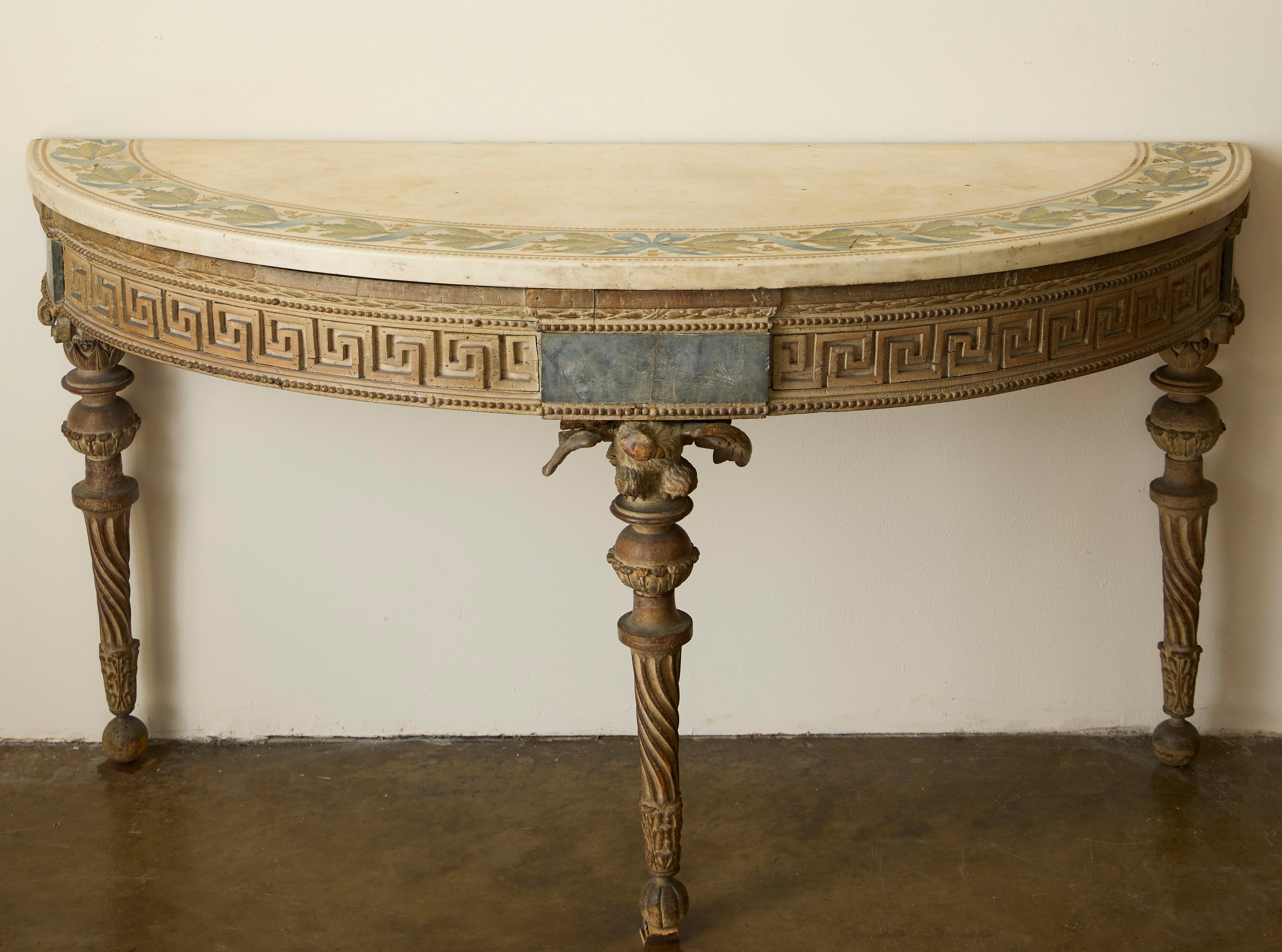 a highly carved Piedmontese side table / console (once gilded) with English demi-lune white marble and scagliola top with blue ribboned oak-leaf band within a pearled (pearl strings) edge above a laurel band and a pierced Grecian / Greek Key frieze