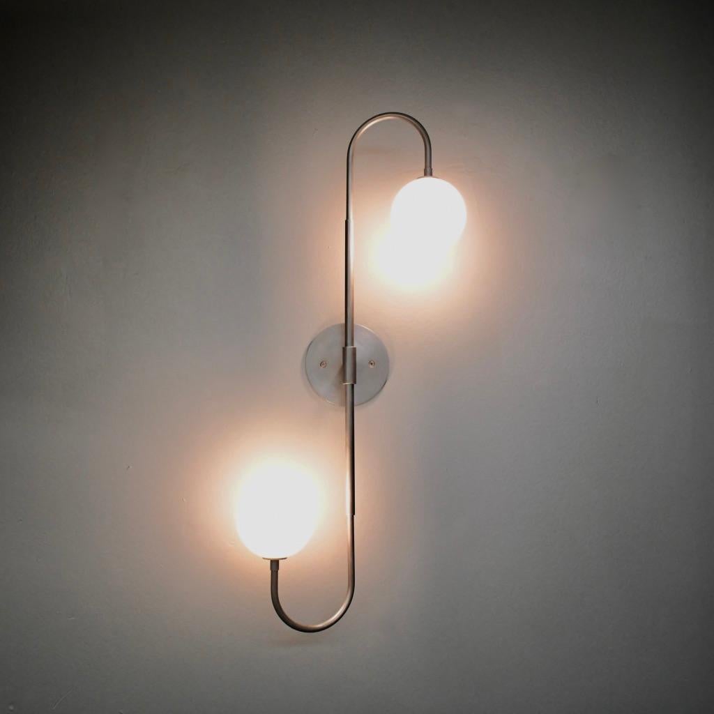 Piega wall lamp or flushmount ceiling fixture by Blueprint Lighting, 2020.

An elegant study in clean lines and graceful curves, Piega is truly a go-anywhere design and is equally at home in residential, commercial and hospitality projects. This