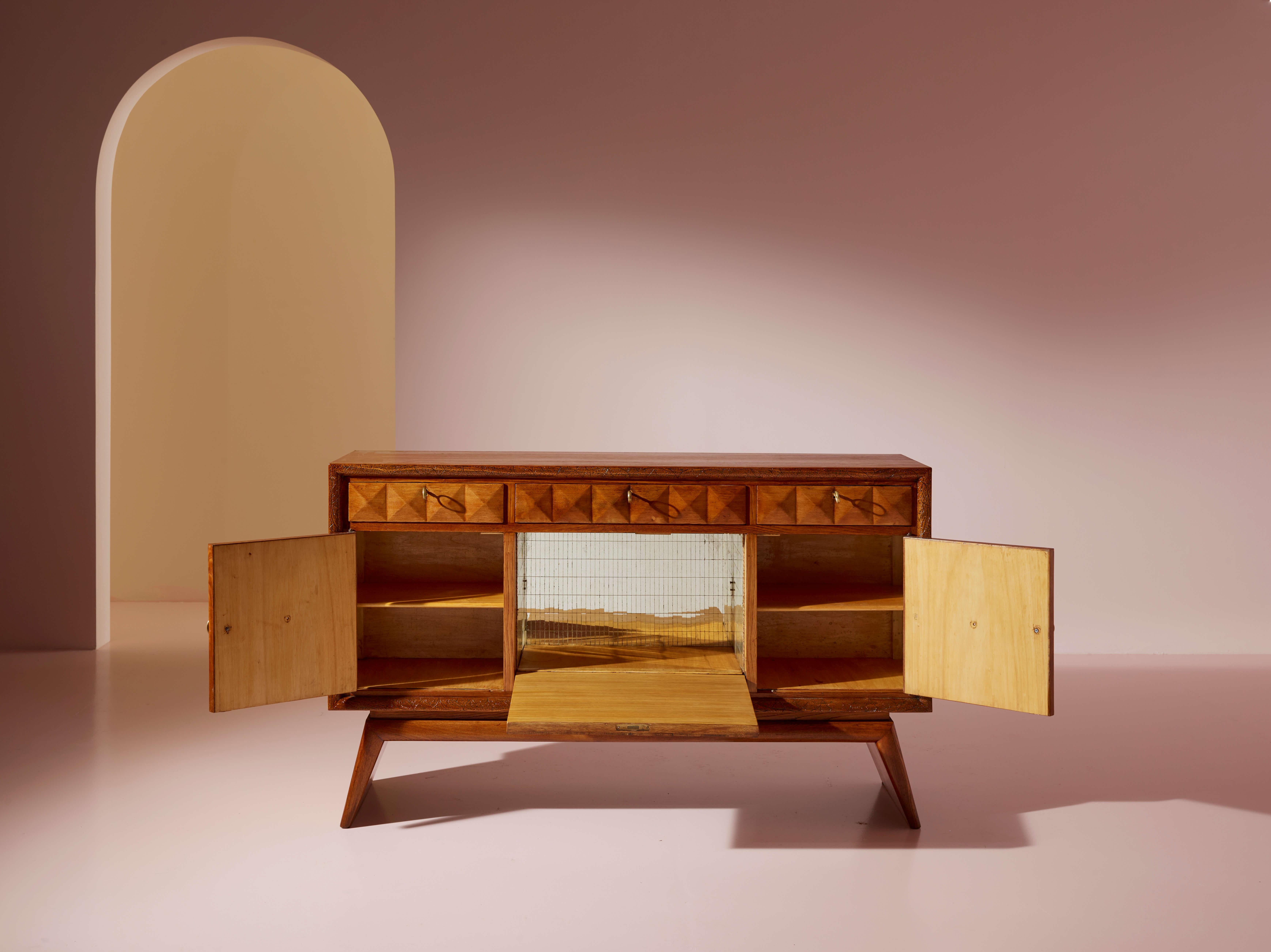 Mid-20th Century Pieluigi Colli carved oak sideboard with mirrored inserts, Italy, 1940s For Sale