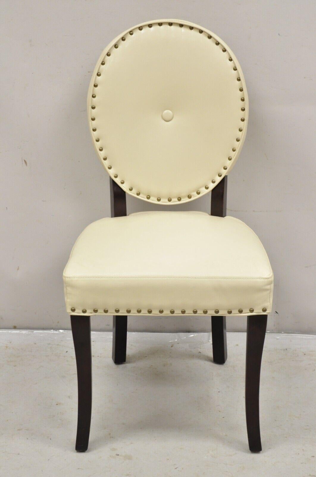 Pier 1 Imports Cadence Ivory Nailhead Oval Back Dining Chairs - Set of 6 Side Chairs. Item features dark cherry finish wooden legs, original labels, beige bonded leather upholstery (see label), very nice set.  21st Century, Pre-owned. Measurements: