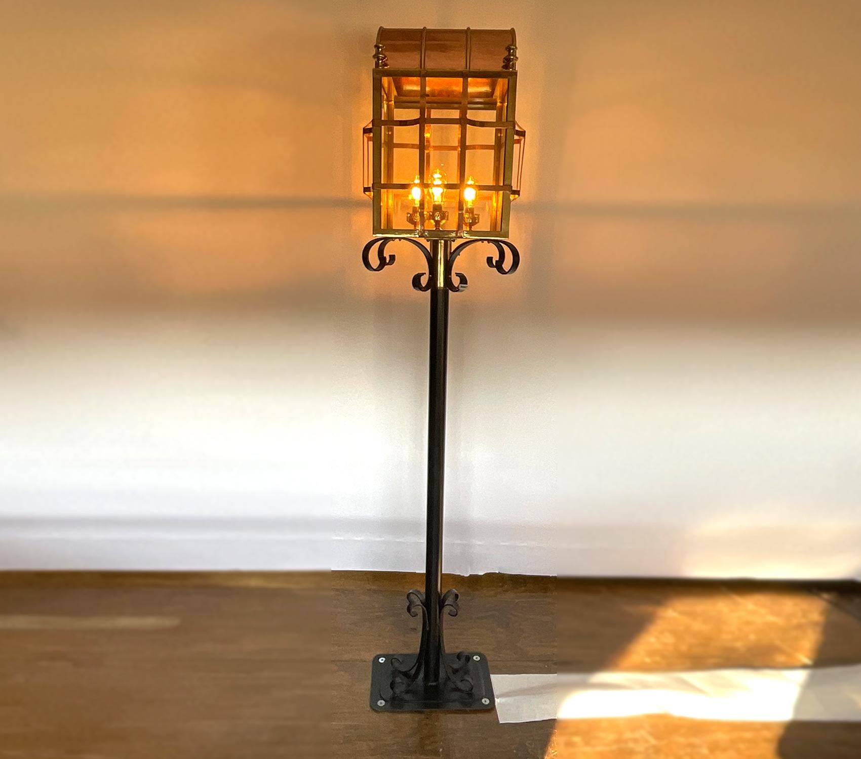Massive outdoor lantern from the famous Pier 4 restaurant in Boston. Purchased at the liquidation auction. Wonderfully restored. Copper and brass housing. Glass panels. Meticulously polished and lacquered. Mounted on iron base. Two