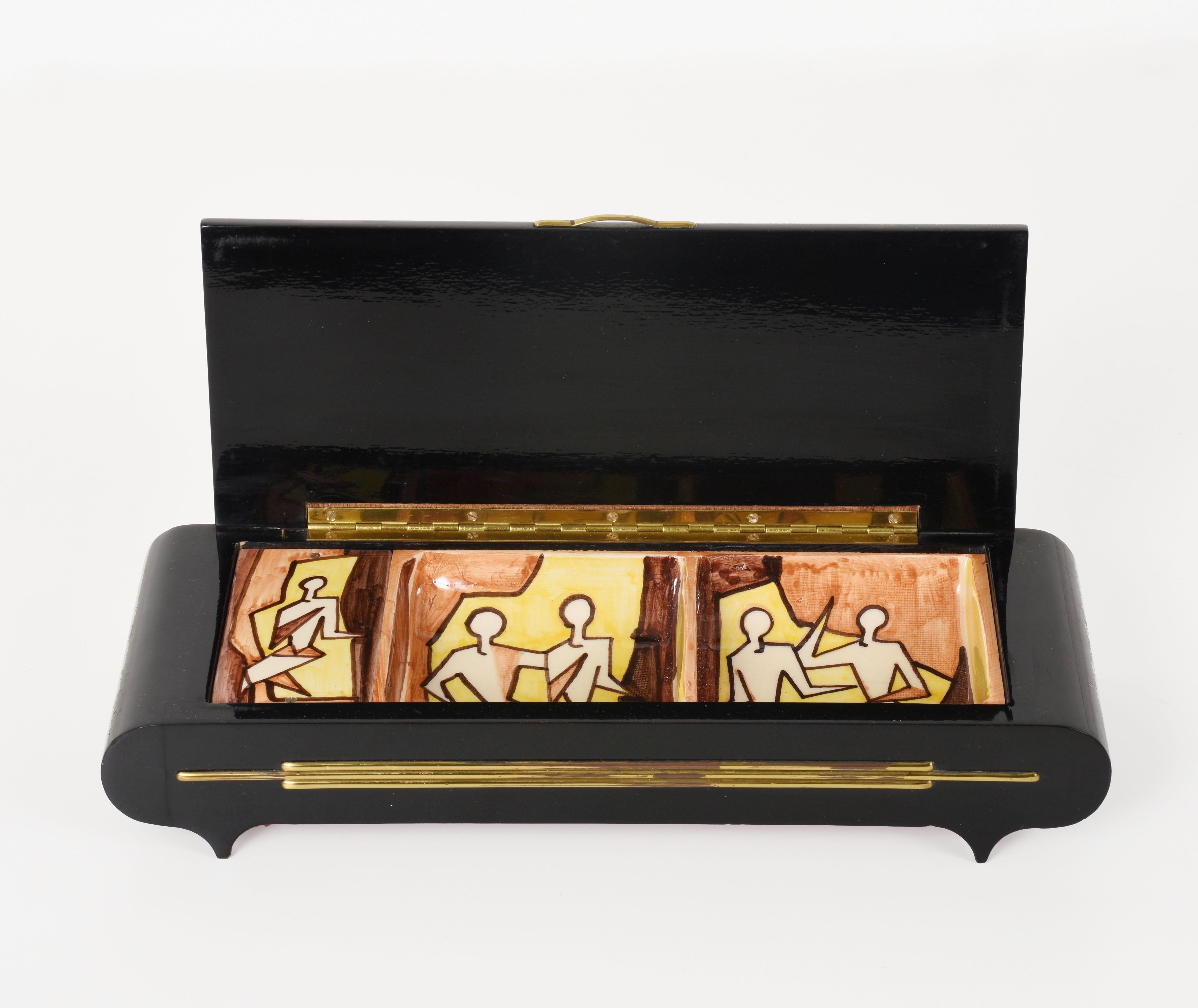 Pier Giovanni Urbino Sardella, vintage ceramic decorated jewelry box
Italian, 1960s for Ceramica, black lacquered wood case with inset hand painted porcelain plaques featuring fox hunters, signed on lid, with working musical mechanism.