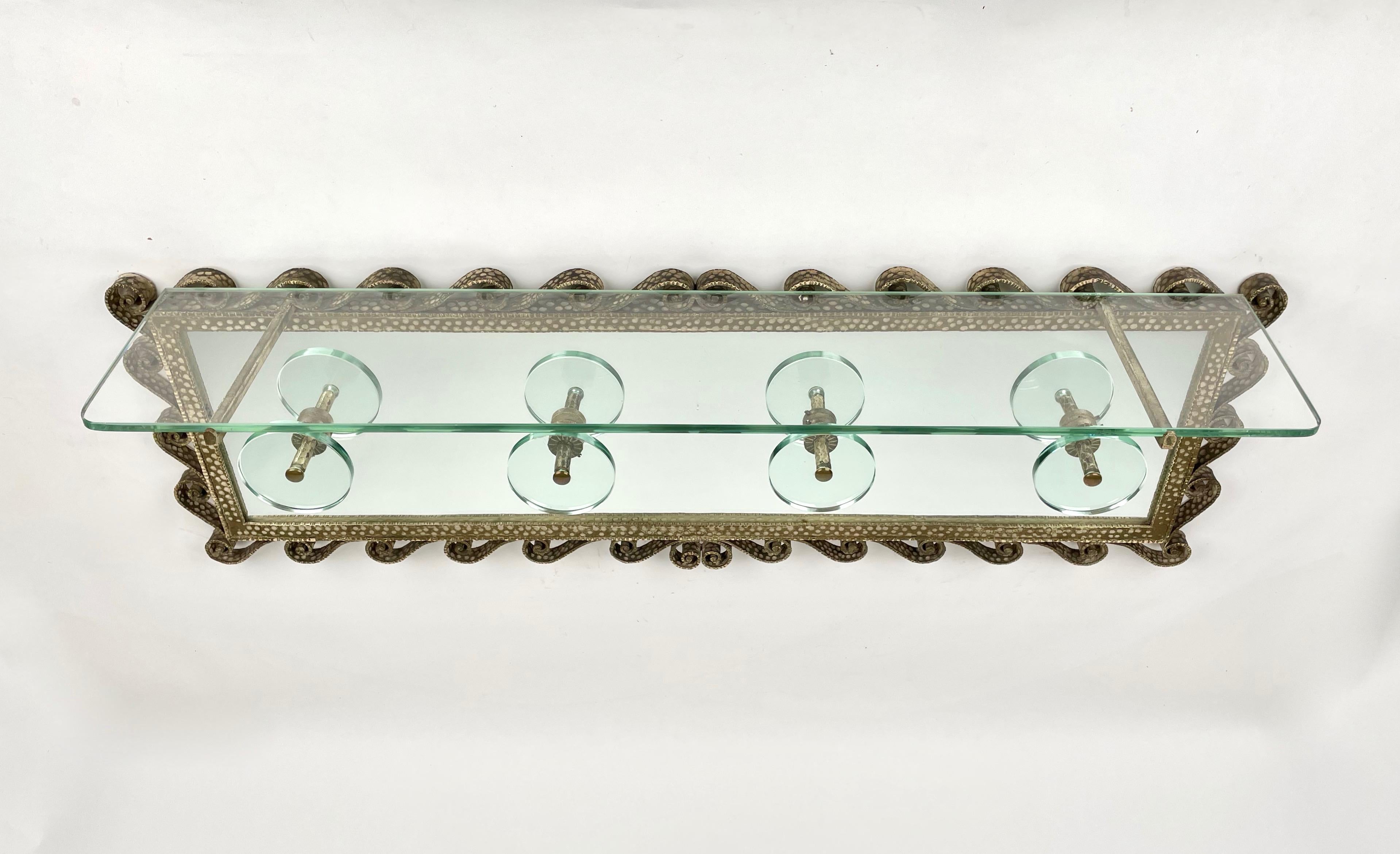 Coat rack in mirror and glass featuring a beautiful iron frame with curlicues and four circular glass hooks by the Italian designer Pier Luigi Colli for Cristal Art. Made in Italy in the 1950s.