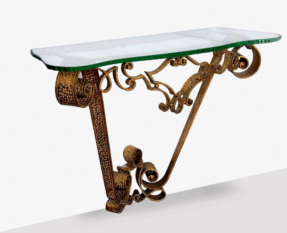 We kindly suggest you read the whole description, because with it we try to give you detailed technical and historical information to guarantee the authenticity of our objects.
Prestigious gilded wrought iron console table; it was conceived and