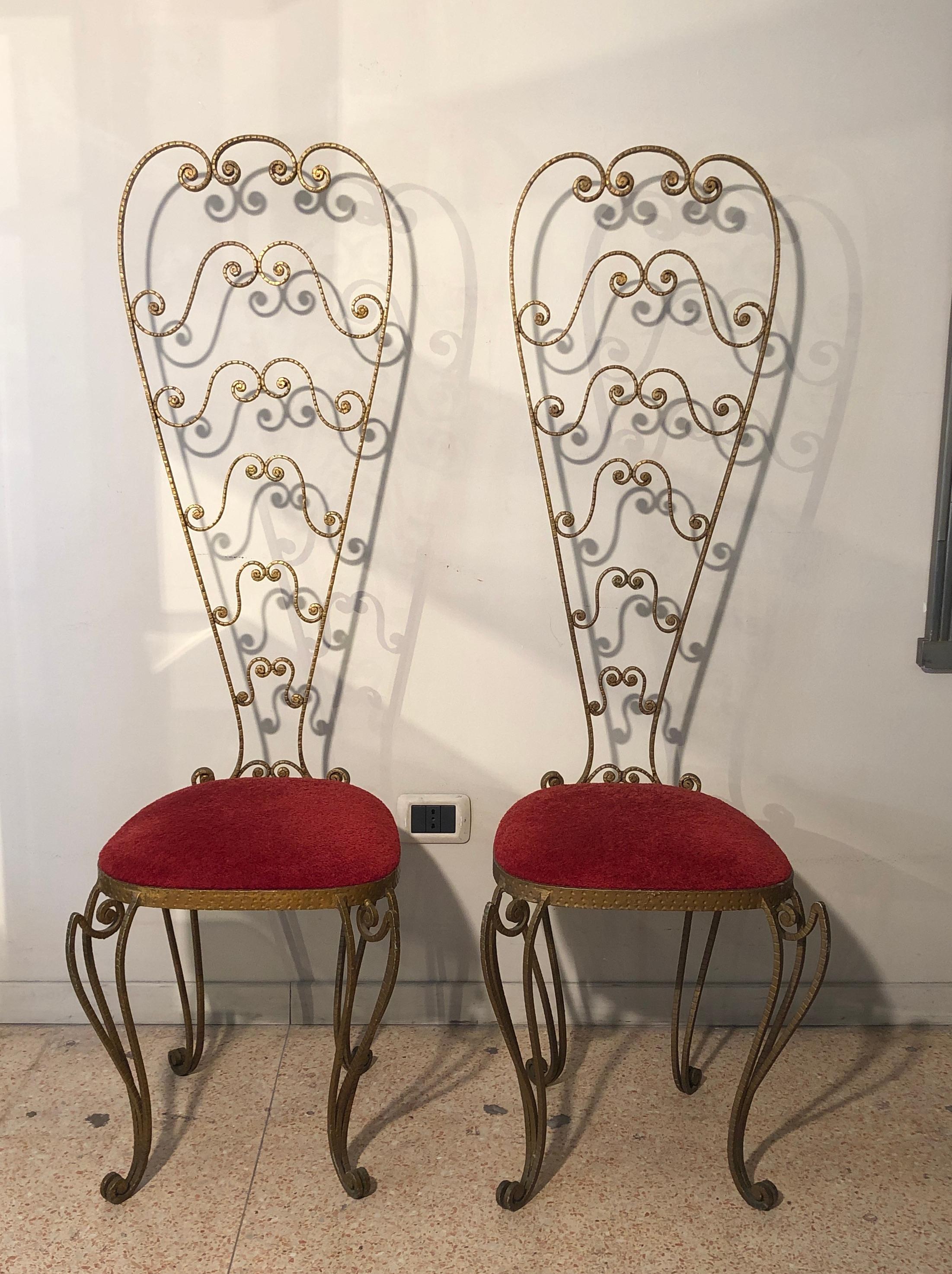 Pier Luigi Colli golden wrought iron chairs from Italy from 1950s. They have been up holstered with vintage red velvet. We have two chairs and each measures H 131 cm, D 24 cm, W 41 cm, seat H 42.5 cm. We have a mirror to be matched with chairs from