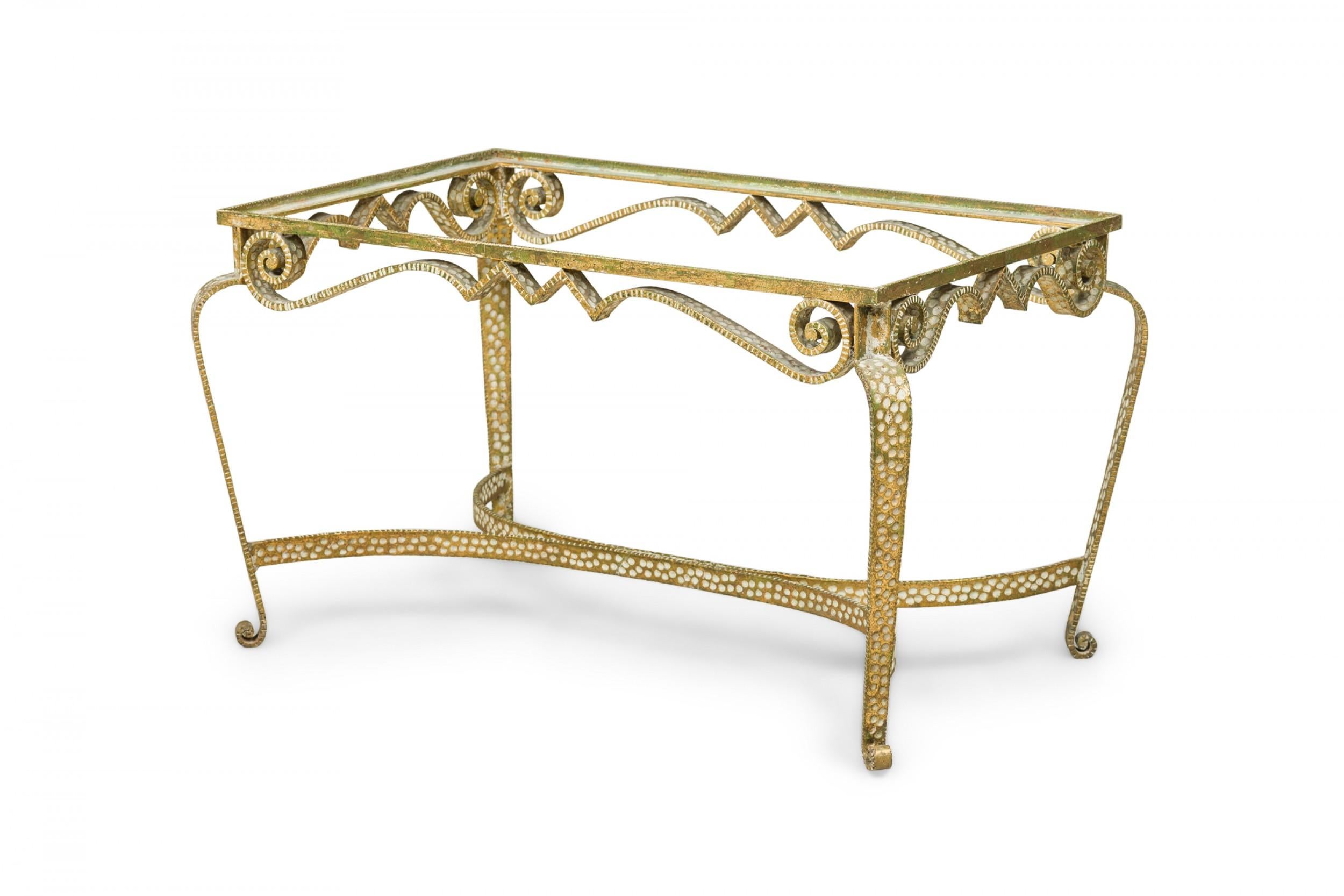 Italian Mid-Century (1950s) low / coffee table frame constructed from pebble hand-hammered gilt iron with scrollwork designs and a stretcher base (missing inset glass or marble table top). (PIER LUIGI COLLI)
 

 Condition Notes:
 Wear to finish,