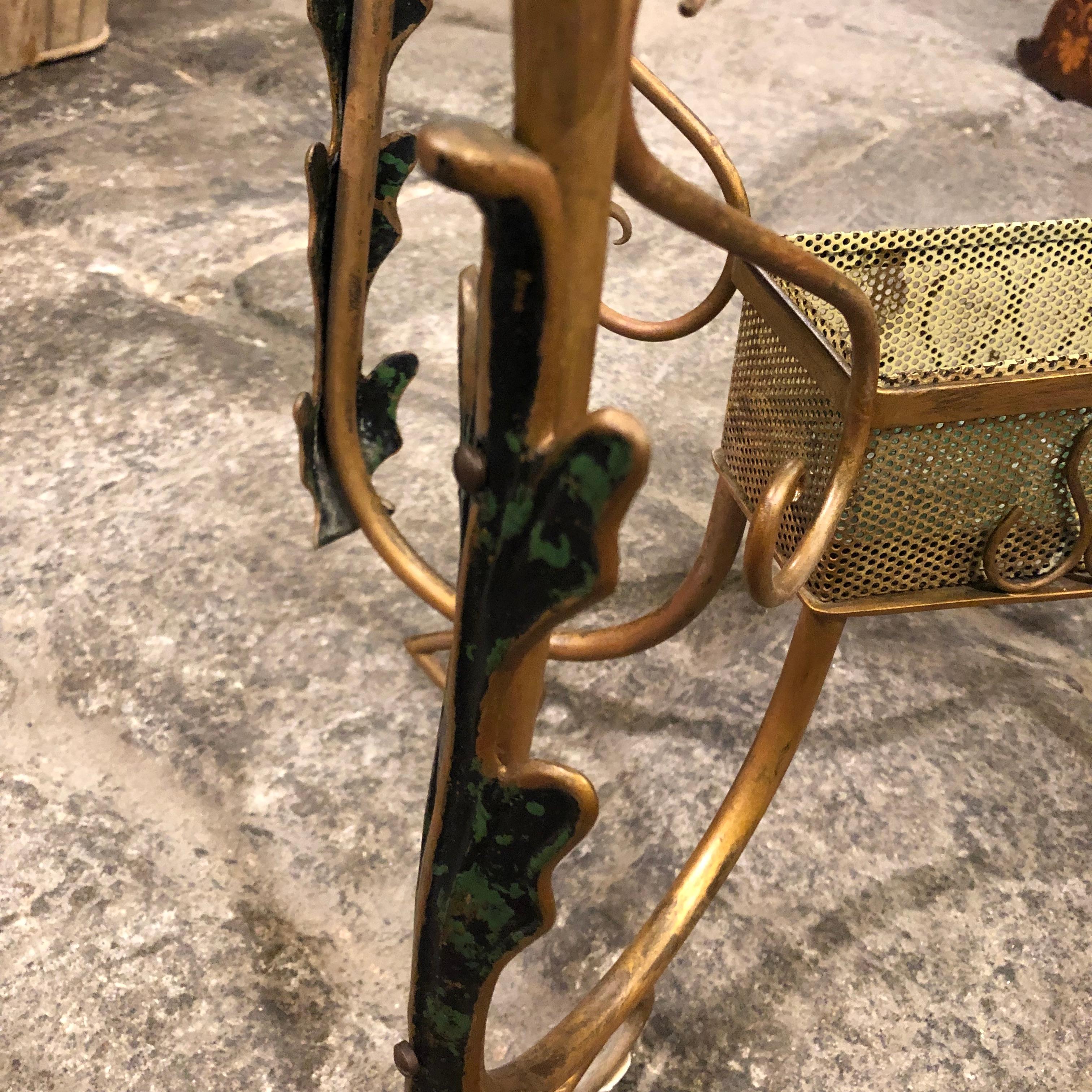 Stylish rectangular brass and heavy Verde Nilo glass side table designed by Pier Luigi Colli in the 1950s. The brass is decorated with green leafs. The original patina create a vibrant vintage look.