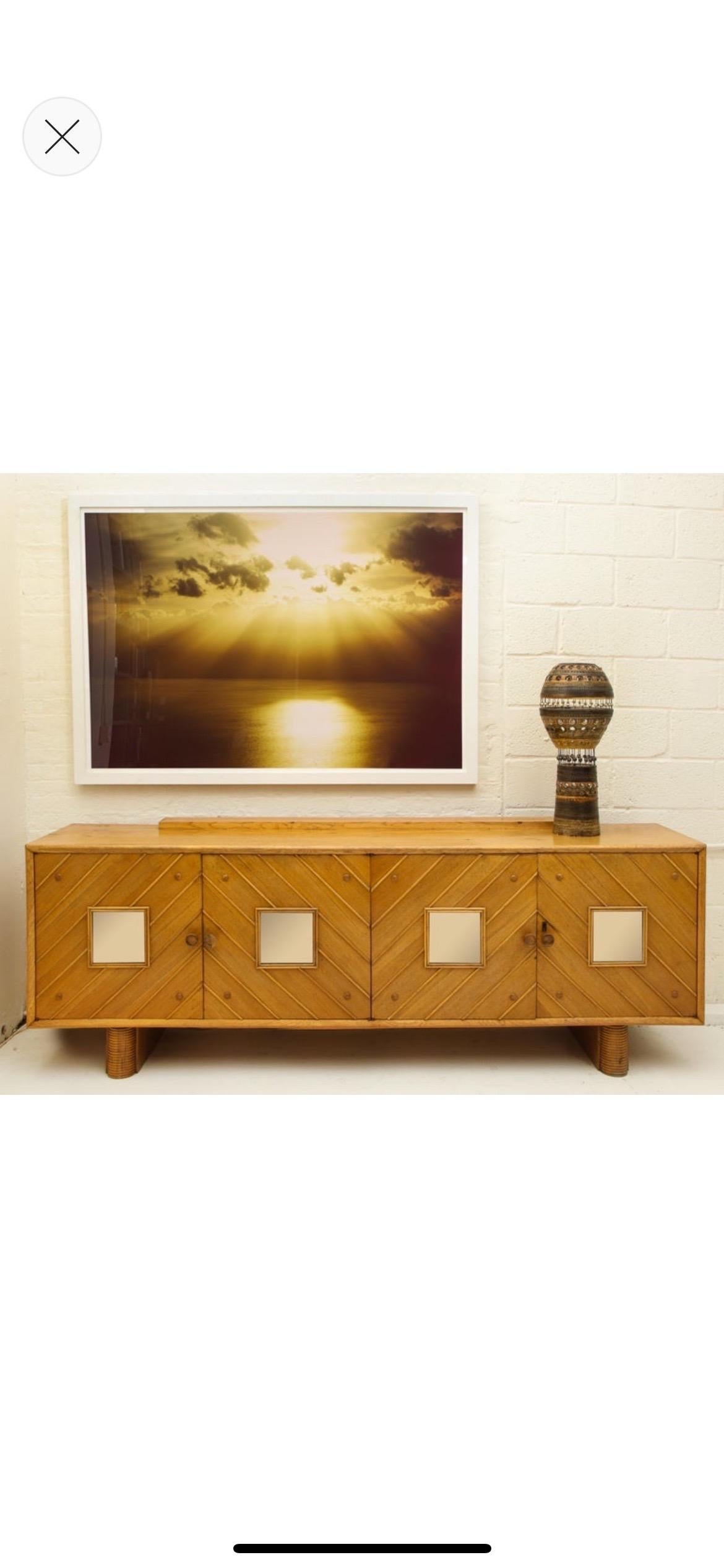 Pier luigi Colli oak sideboard, Mid-Century Modern, Italy, 1950s

Beautiful oak sideboard. The oak has lovely patina throughout the piece. 
It is a large-scale sideboard with four doors and architectural details throughout.
Amazing oak grain visible
