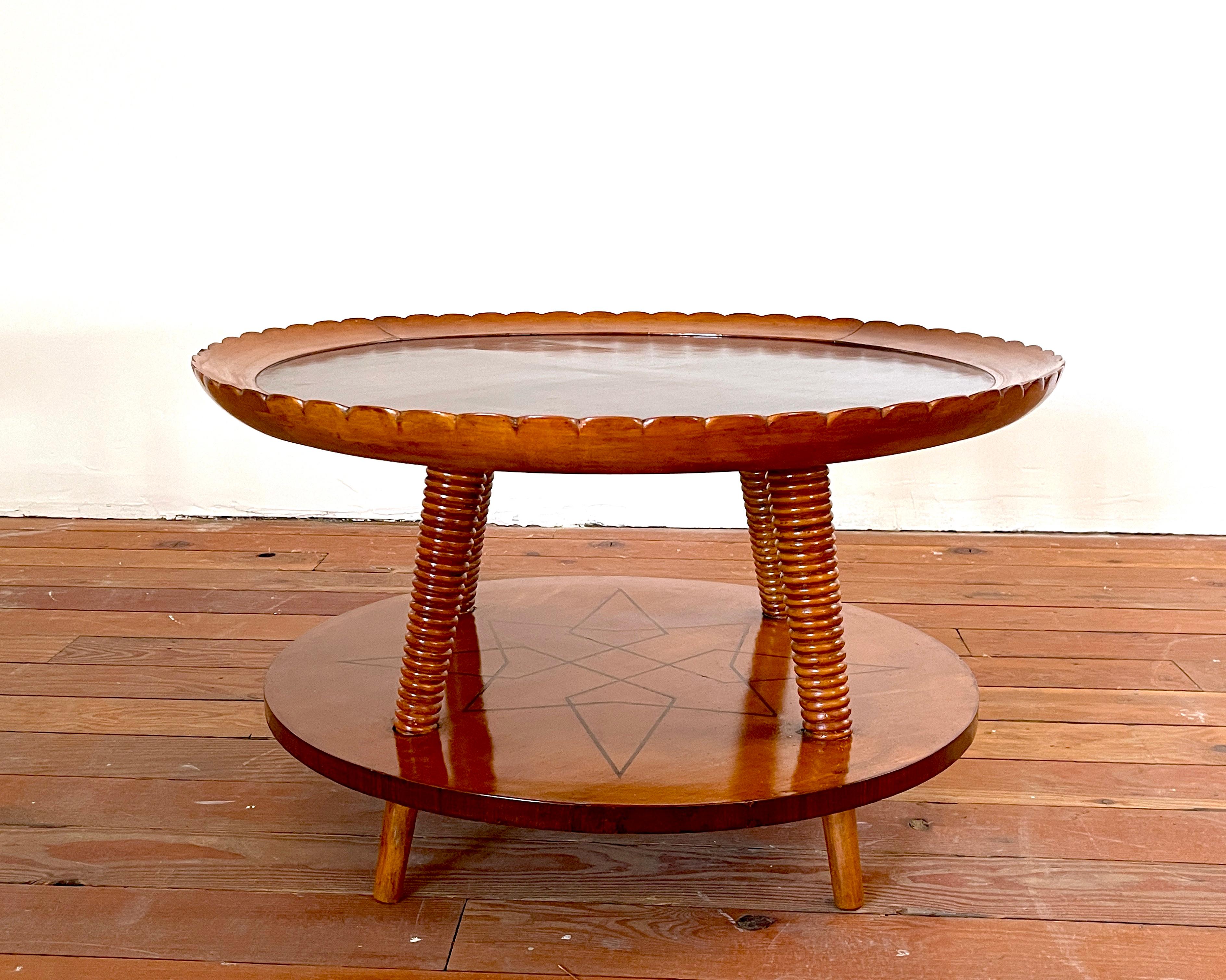 Incredible 1940's Italian coffee table by Pier Luigi Colli with scalloped edge and 2 tiers with intricate star inlay on lower shelf. 
Angles legs and gorgeous statement piece for any room!