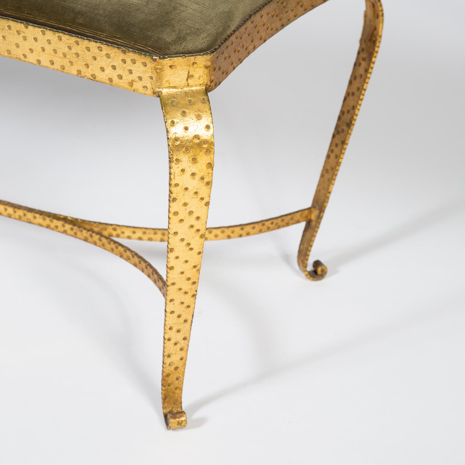 Matching single stool and small bench set in hammered wrought iron with a gilt finish, designed by Pier Luigi Colli. Original green velvet upholstery.

Individual item dimensions:
Stool: 42(W) x 41(D) x 40(H)cm 
Bench: 40(D) x 90(L) x 40(H)cm
 