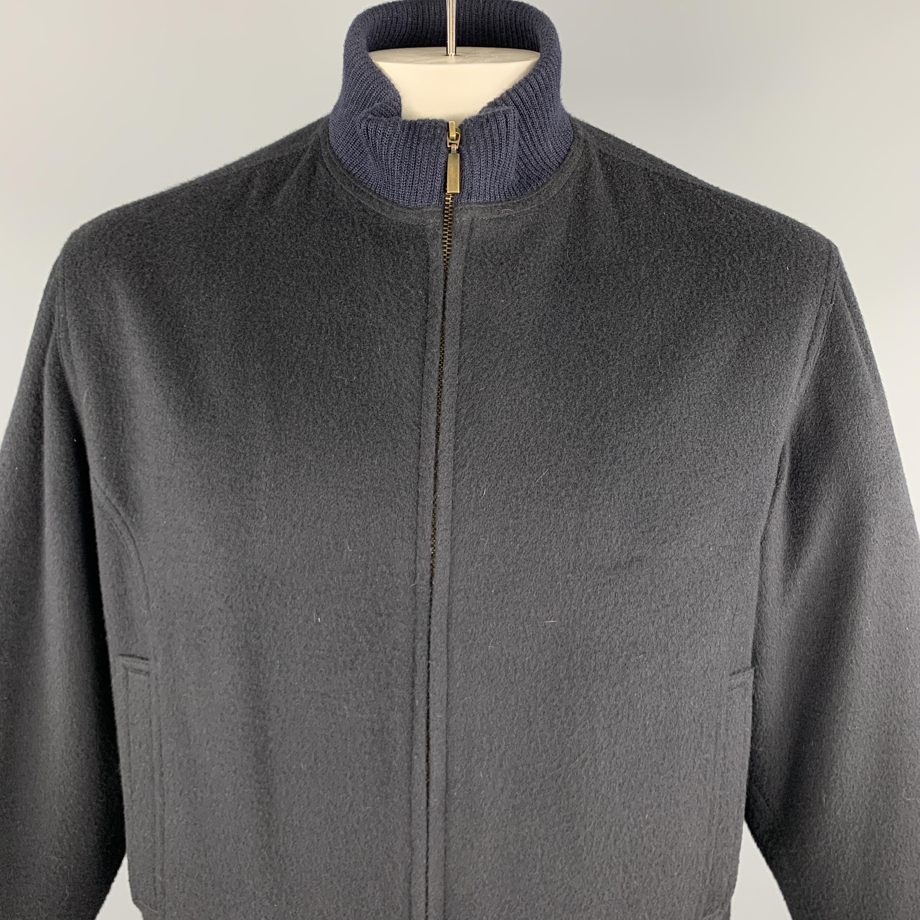 PIER LUIGI DELLA SPINA jacket comes in a navy cashmere featuring a high ribbed collar and a full zip closure. Made in Italy.

Excellent Pre-Owned Condition.
Marked:

Measurements:

Shoulder: 18 in. 
Chest: 46 in.
Sleeve: 24.5 in. 
Length: 26 in. 