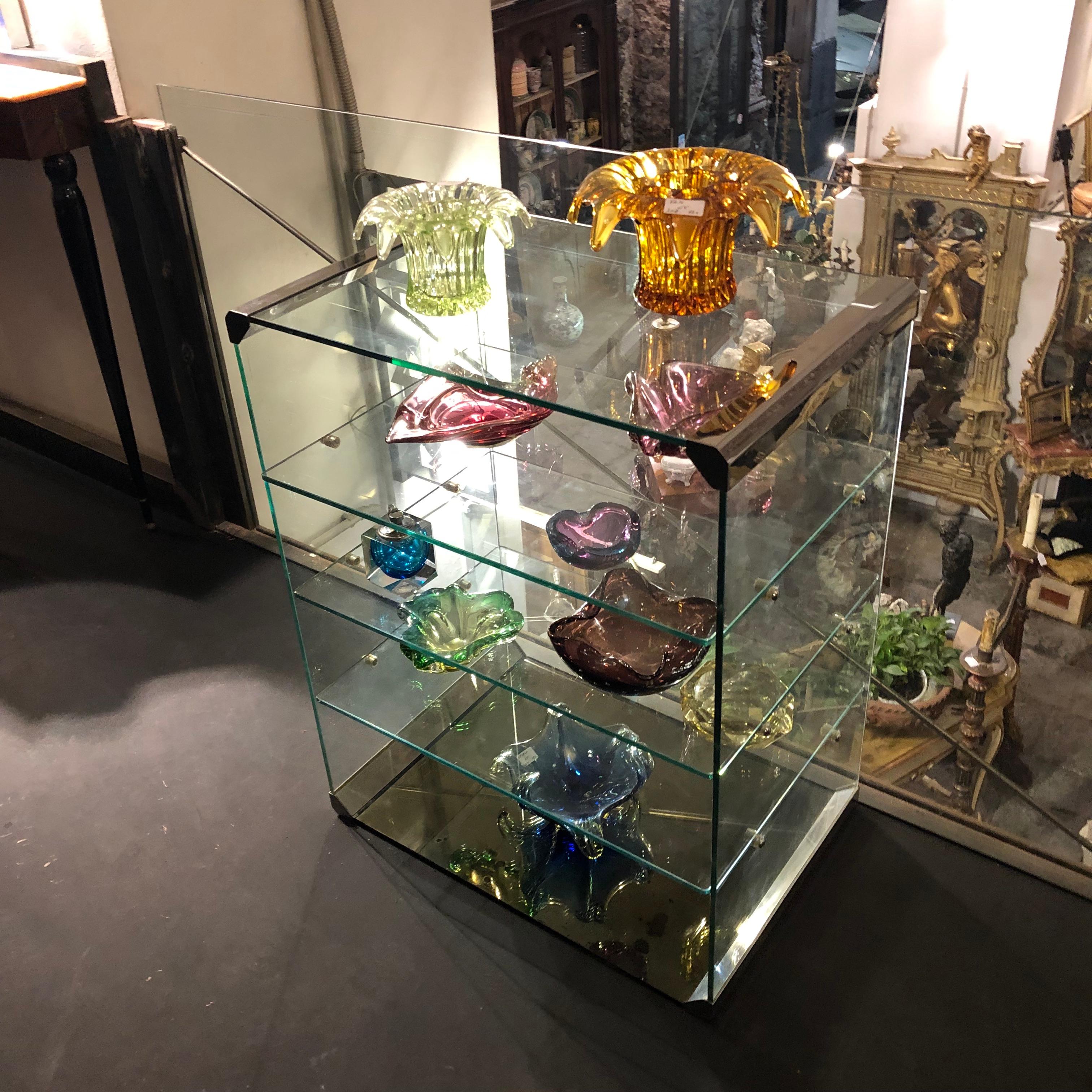 Stylish glass and steel stereo rack by Gallotti & Radice. Glasses are in perfect conditions, the mirror glass lower part has signs of the age.