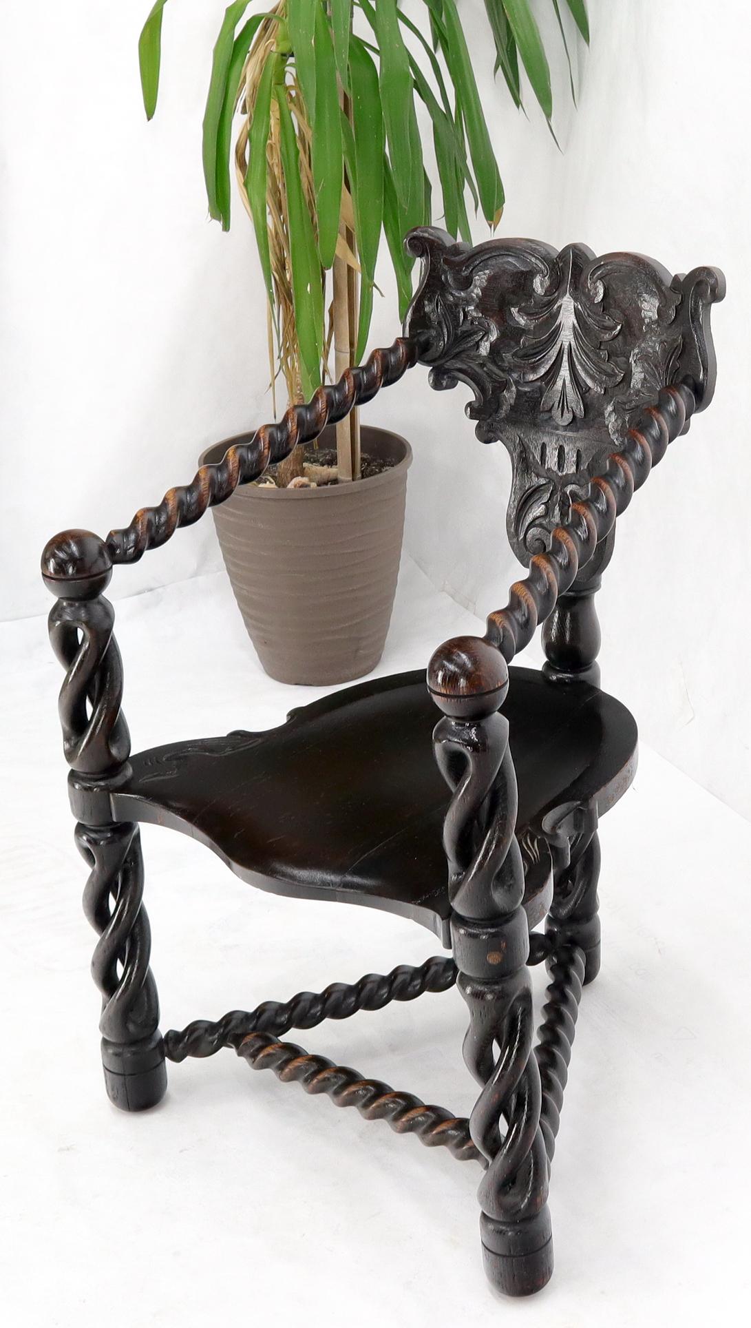 Impressively carved tri legged twisted rope Jacobean style carving armchair.