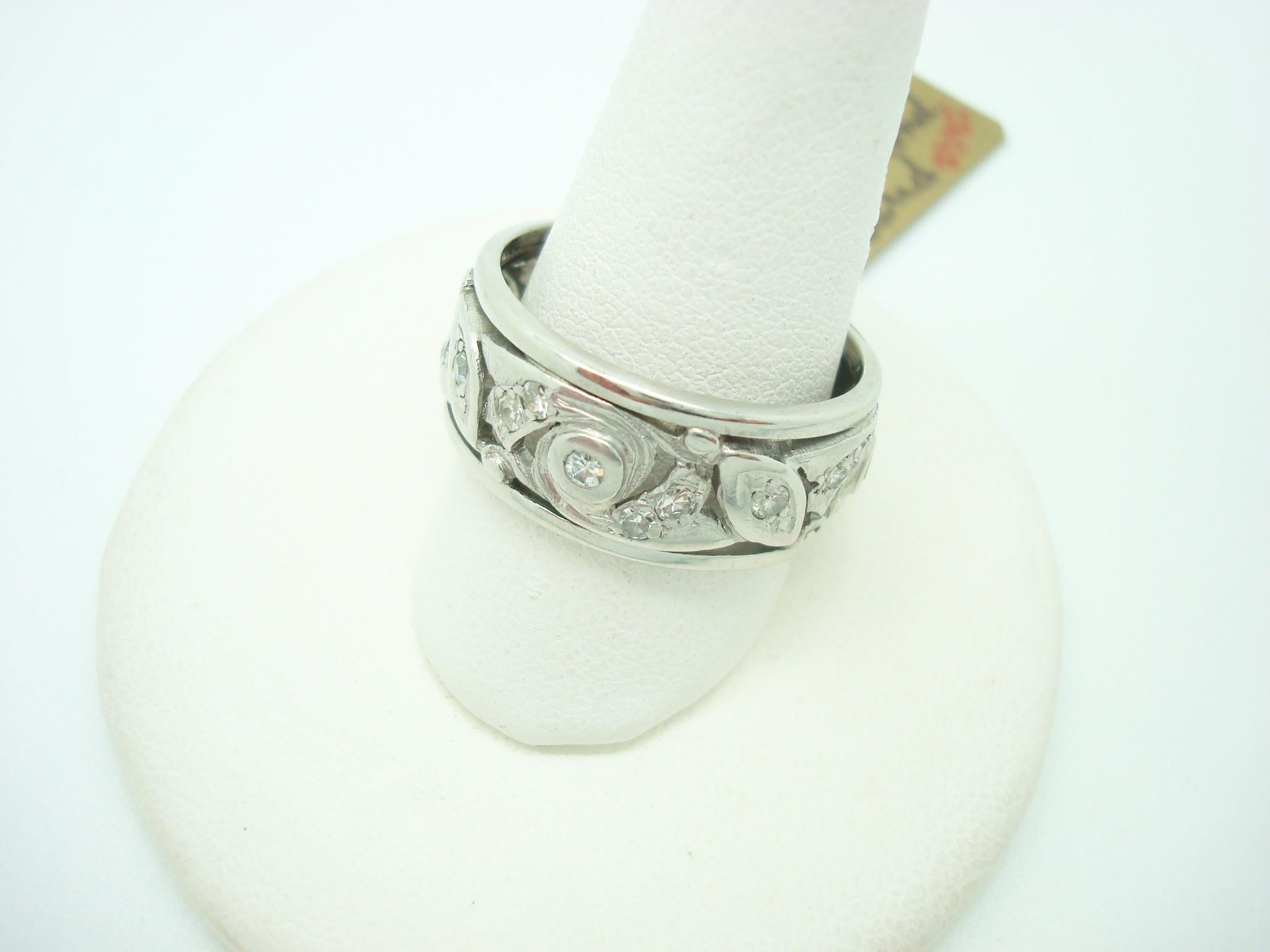 Pierced Art Deco Platinum Genuine Natural Diamond Band Ring (#J2385)

Charming platinum diamond ring band in a lovely pierced Art Deco. Set in the wide band are dazzling small round diamonds, and they measure 1.5mm. The ring fits a 6 1/2 finger, and