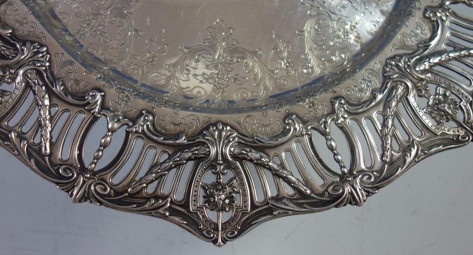 Pierced border by J.E Caldwell sterling silver sandwich plate/platter. It features a pierced applied cast border with swags and hand chased interior. It has a vintage monogram and an inscription on the reverse with date November 24, 1937 (see