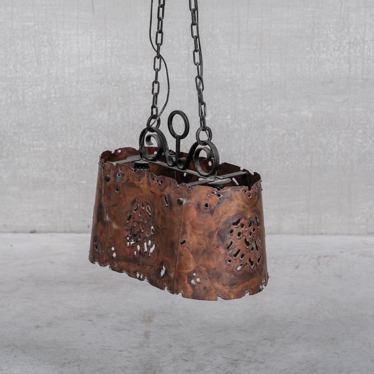 A patinated copper pendant light. 

Holland, c1970s. 

Pierced to diffuse light. 

Since re-wired and PAT tested. 

Some original chain and ceiling rose retained and provided. 

Location: Belgium Gallery.

Dimensions: 37 H x 45 W x 25 D