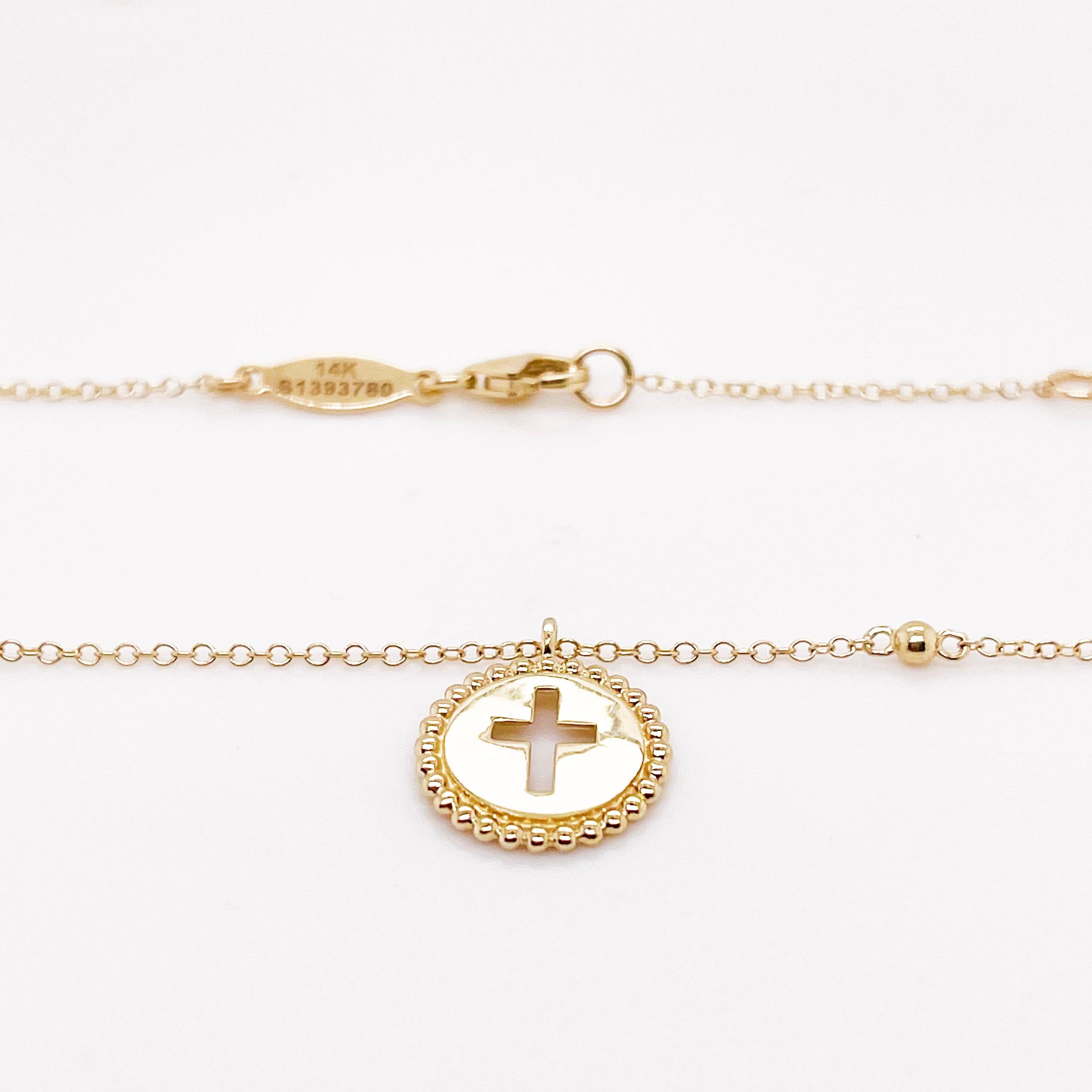 This stunning cross necklace takes a new spin on the traditional cross jewelry lovers have worn for years. The beautiful cut out of the cross in surrounded by 14 kt yellow gold with beaded edges. This is a stunning piece to be worn by it's self or