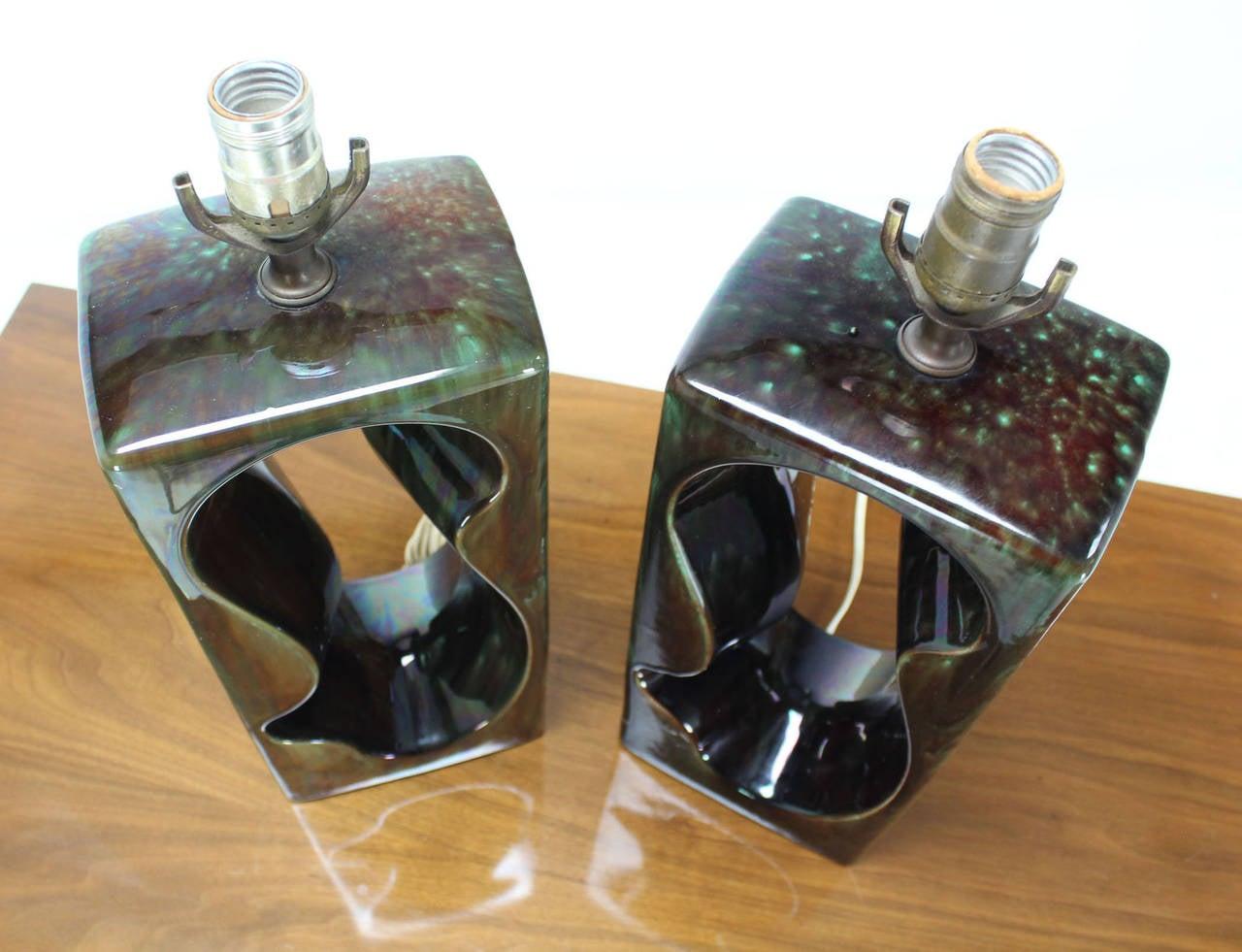 Pair of  vintage circa 1970s glazed Art pottery table lamps. Dark olive green gloss glaze.